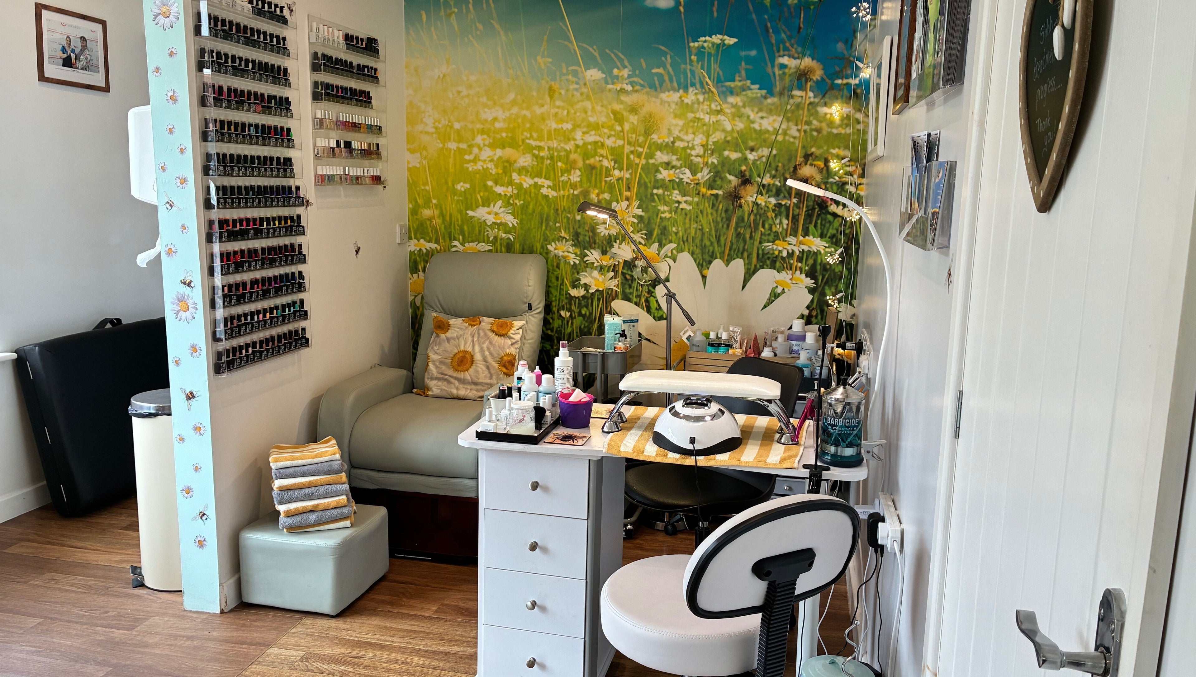 Relaxing nail salon corner at Tranquil Fields, Farrington Gurney, England, GB, with daisy-themed decor.