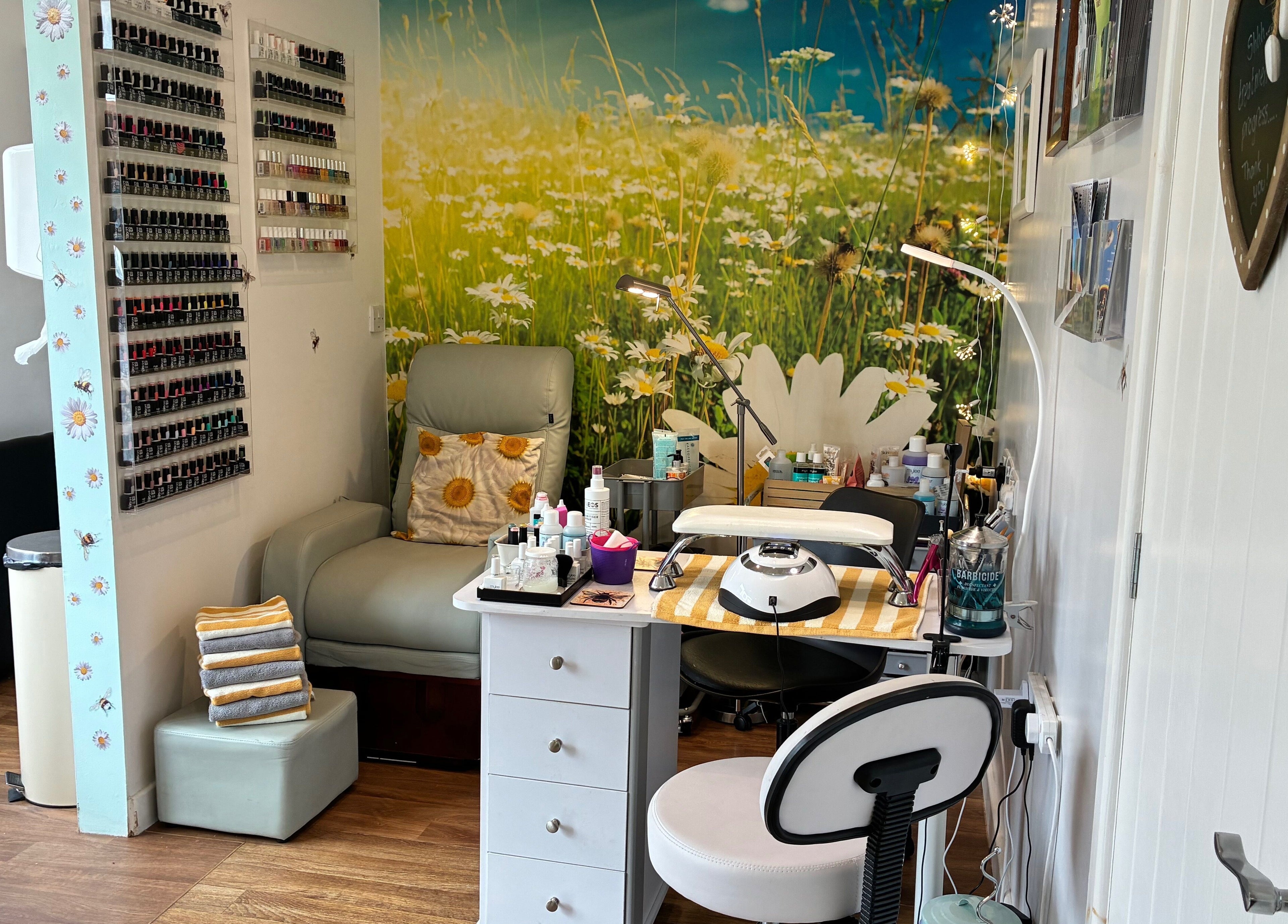 Relaxing nail salon corner at Tranquil Fields, Farrington Gurney, England, GB, with daisy-themed decor.