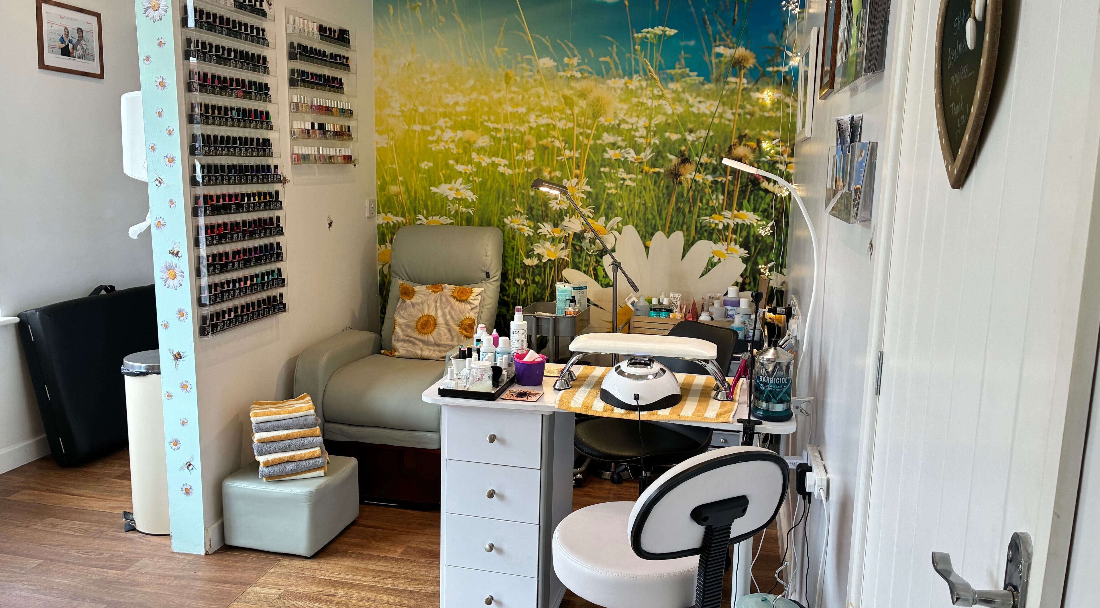 Relaxing nail salon corner at Tranquil Fields, Farrington Gurney, England, GB, with daisy-themed decor.