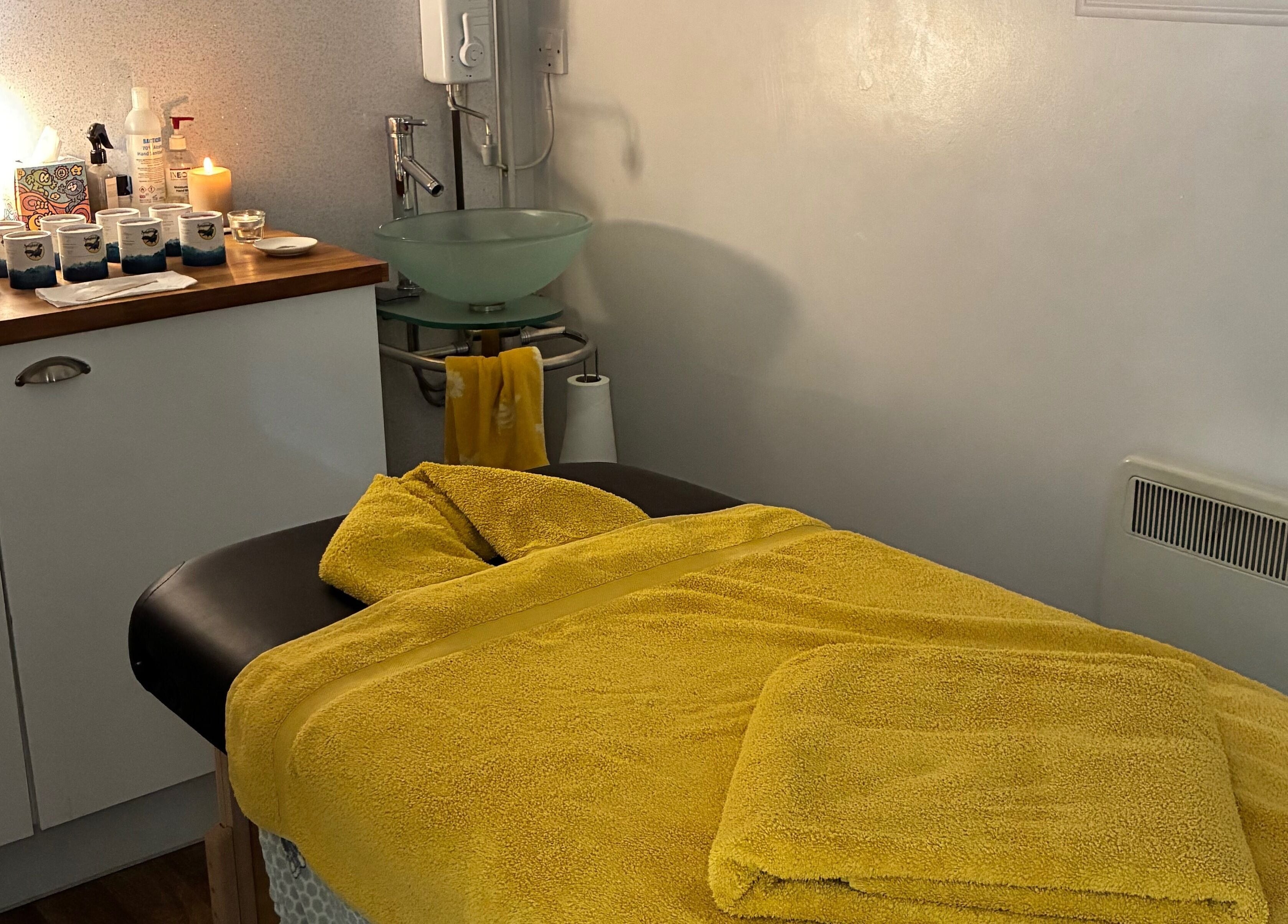 Massage table with yellow towels at Tranquil Fields, Farrington Gurney, England, GB.