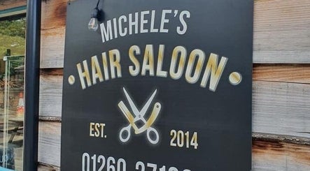Rustic sign outside JADE Hair at Congleton, England, GB showcasing scissors and razor logo.