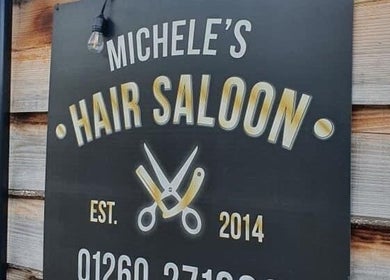 JADE Hair salon sign in Congleton, England, GB, showcasing elegant scissors and razor logo.
