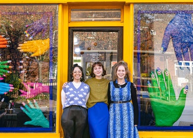 Colorful nail art display with smiling staff outside Tru Nail Art, Brighton, England, GB.