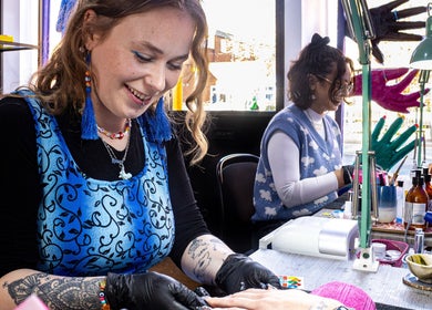 Nail artist at Tru Nail Art in Brighton, England, GB creating unique designs for a client.