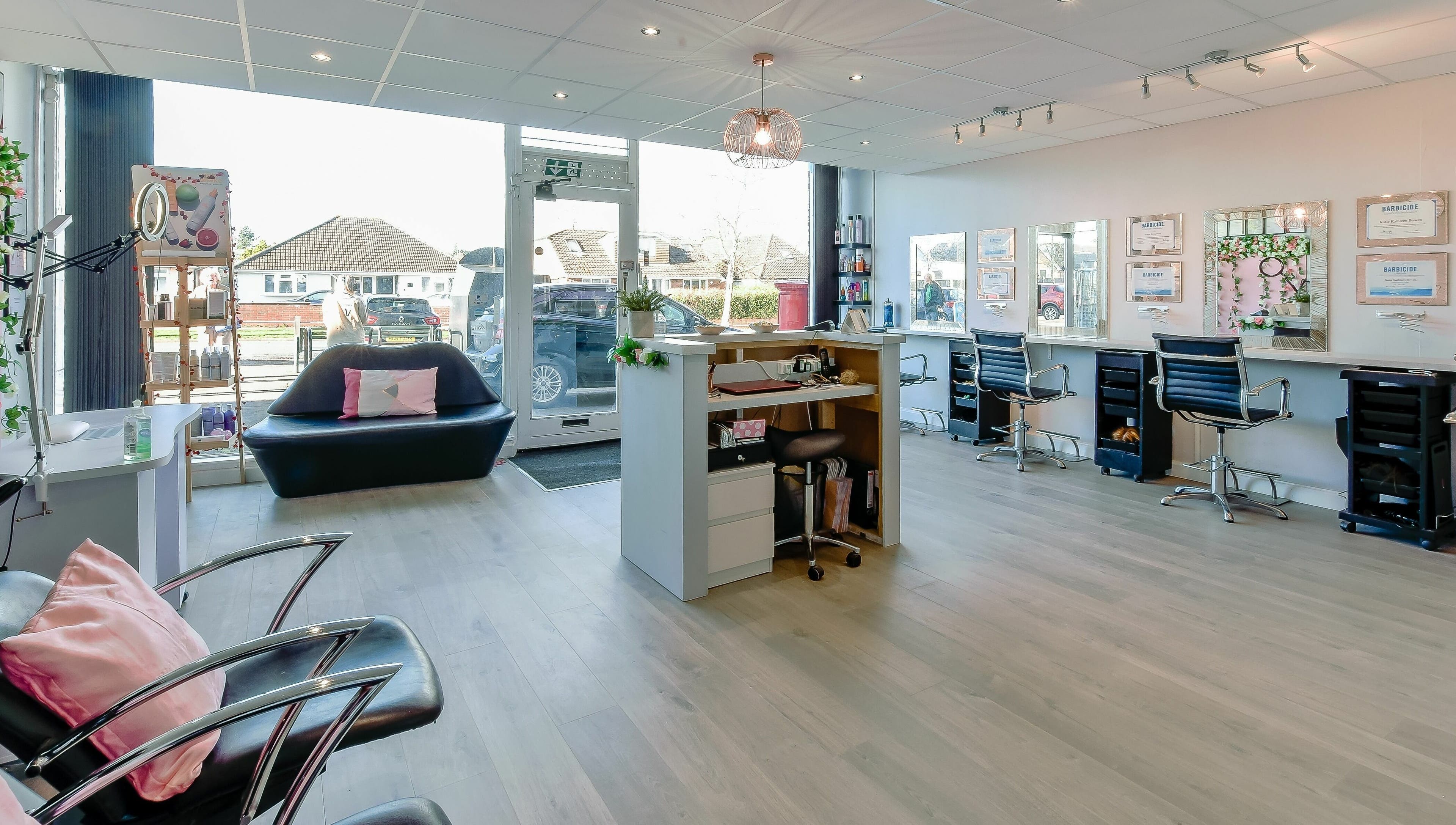 Spacious salon interior at Diverse Hair Design, Waterlooville, England, GB, featuring modern styling stations.