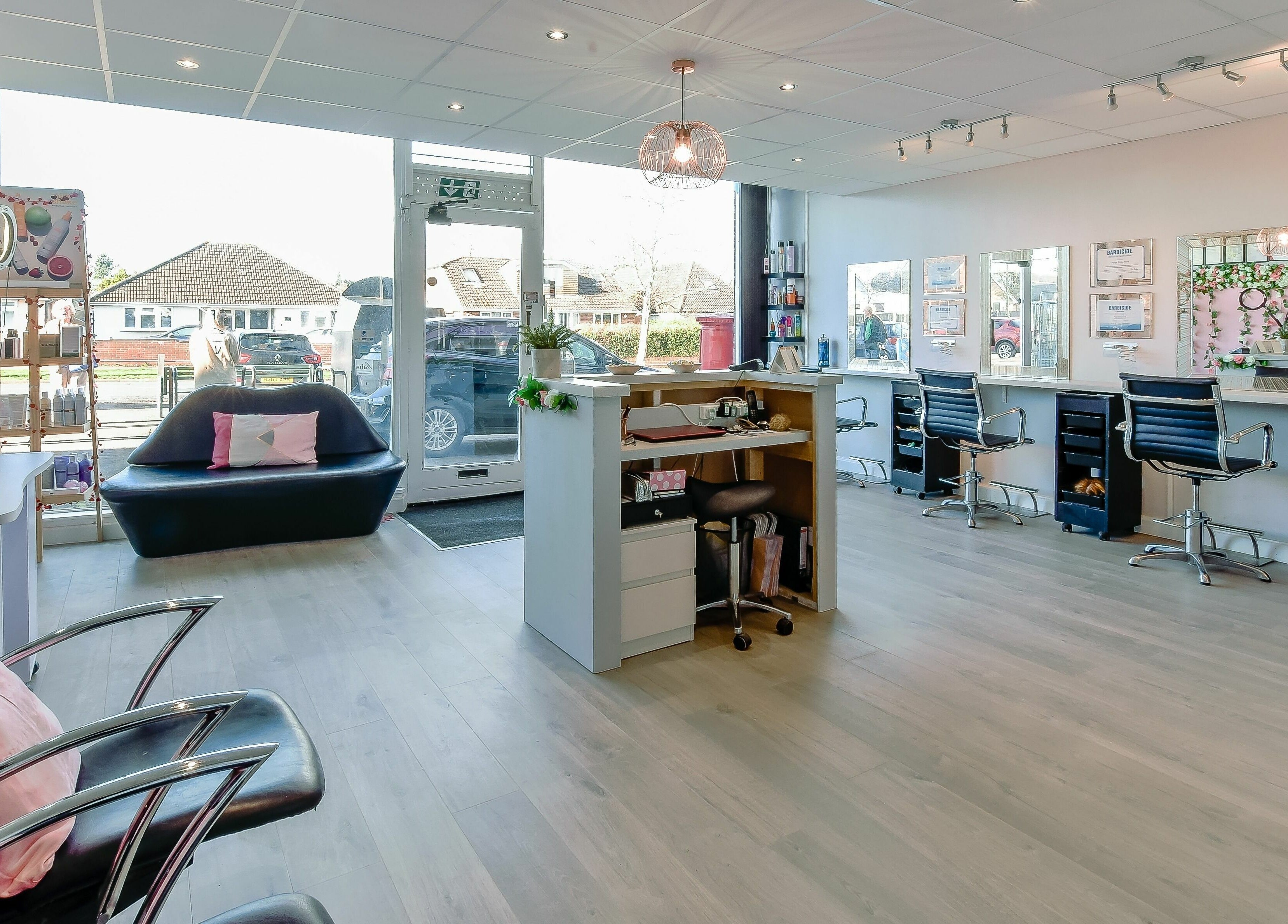 Spacious salon interior at Diverse Hair Design, Waterlooville, England, GB, featuring modern styling stations.