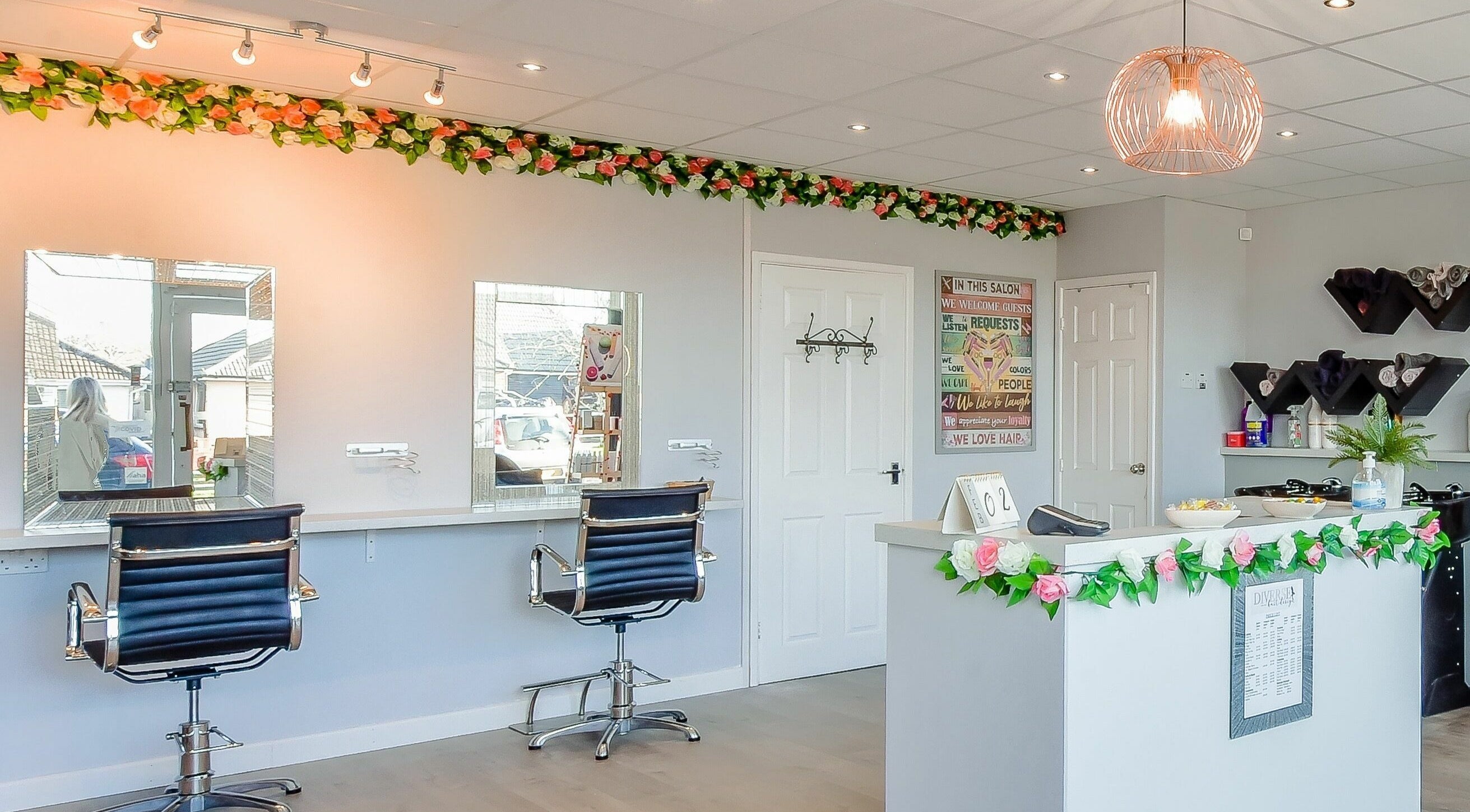 Stylish interior of Diverse Hair Design in Waterlooville, England, GB, featuring elegant salon styling stations.