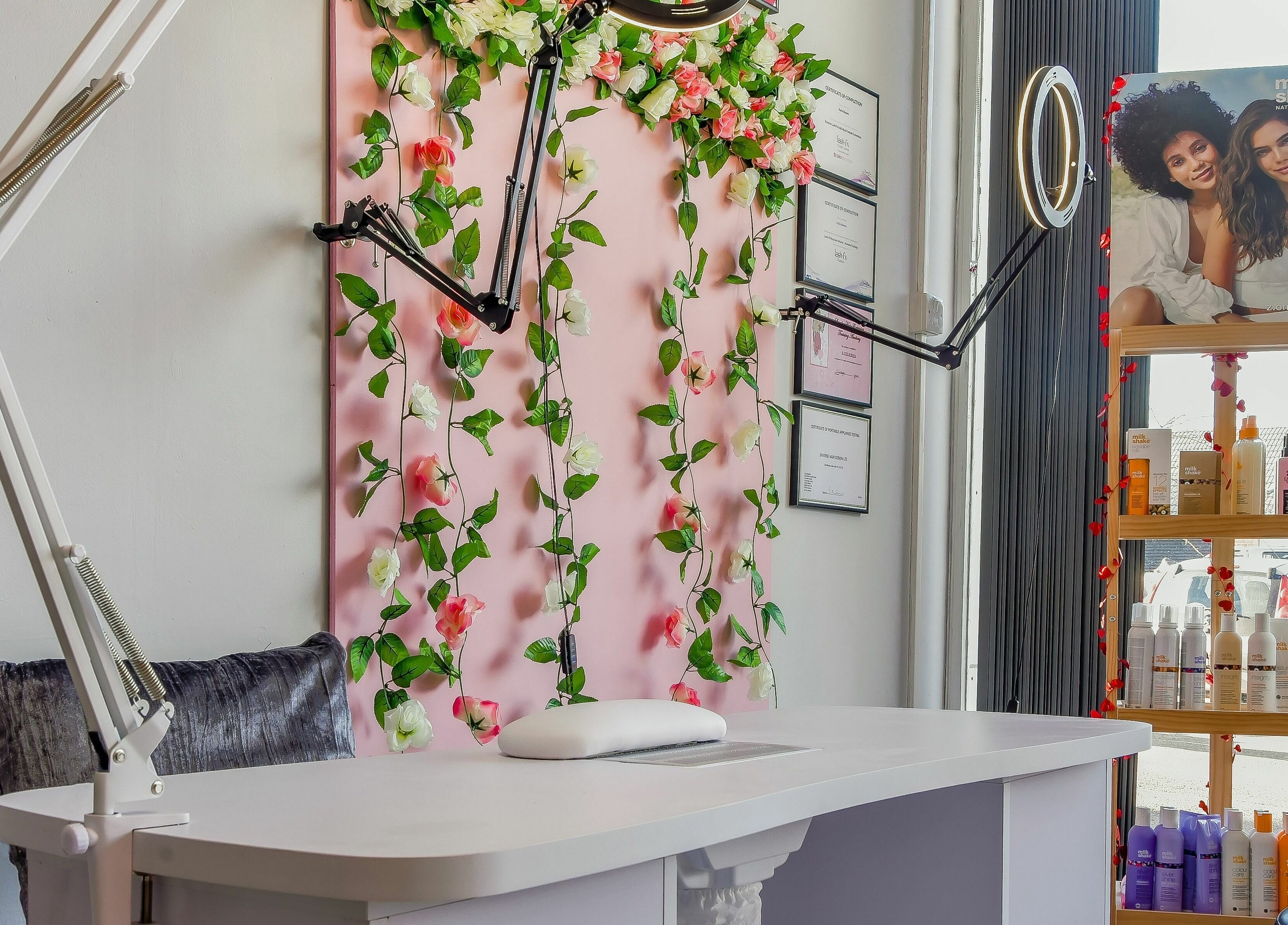 Beautiful salon setup at Diverse Hair Design in Waterlooville, England, GB with floral decor and beauty products.