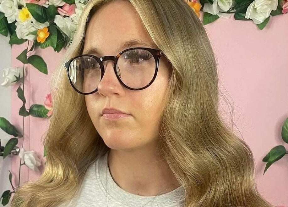 Elegant waves hairstyle at Diverse Hair Design, Waterlooville, England, GB. Trendy and stylish look in a floral setting.