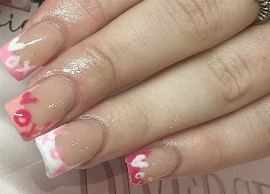 Stylish nail art with pink and white hues at Diverse Hair Design, Waterlooville, England, GB.
