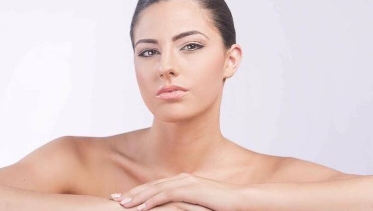 A woman with glowing skin at D Beauty Bar, Naxxar, MT, showcasing natural beauty and wellness services.