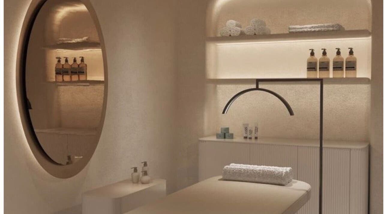 Luxurious treatment room at D Beauty Bar, Naxxar, MT, featuring modern decor and ambient lighting.
