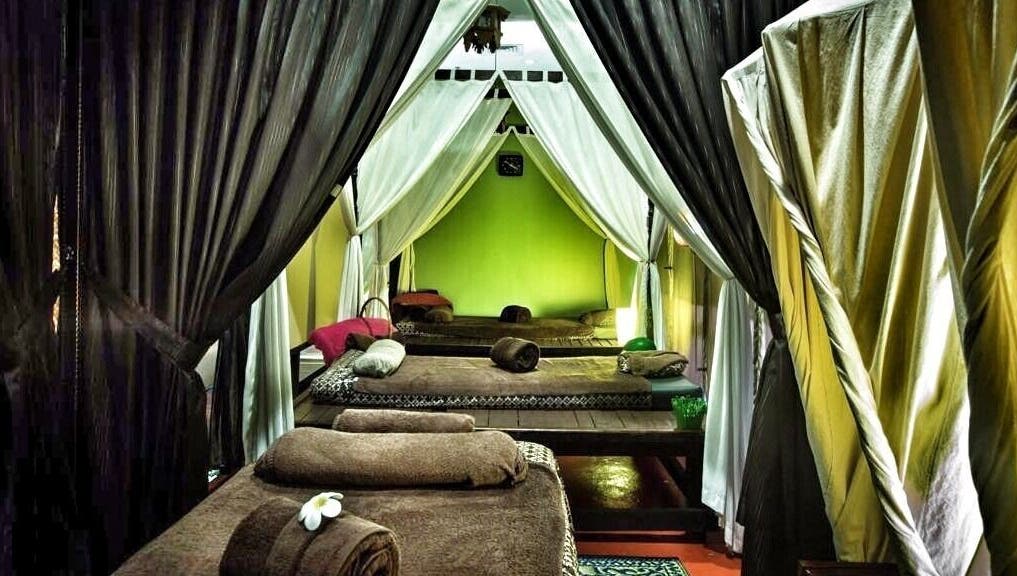 Relaxing spa beds with draped curtains at Khatulistiwa Spa - Johor, Johor, MY for ultimate tranquility.