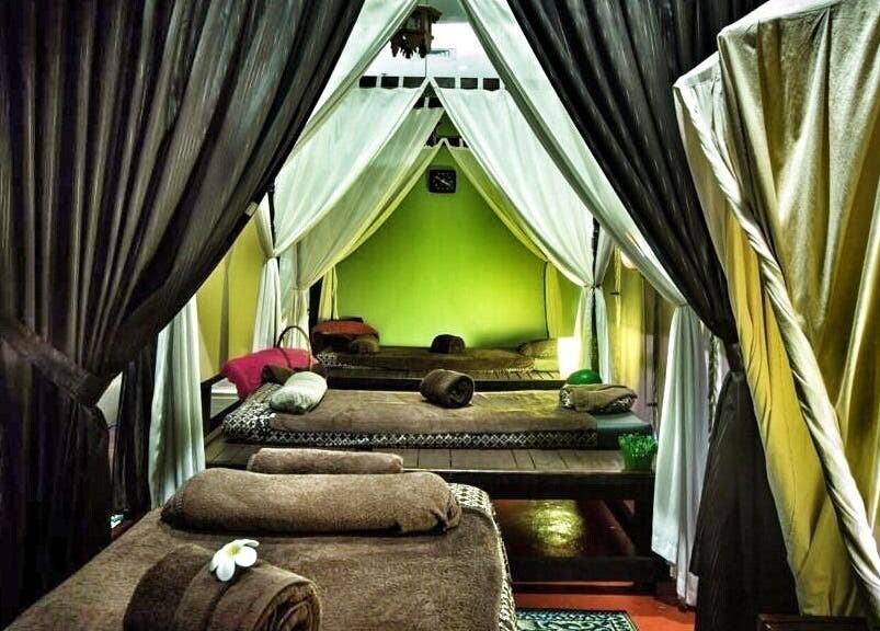 Relaxing spa beds with draped curtains at Khatulistiwa Spa - Johor, Johor, MY for ultimate tranquility.