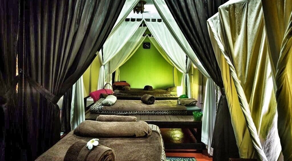 Relaxing spa beds with draped curtains at Khatulistiwa Spa - Johor, Johor, MY for ultimate tranquility.