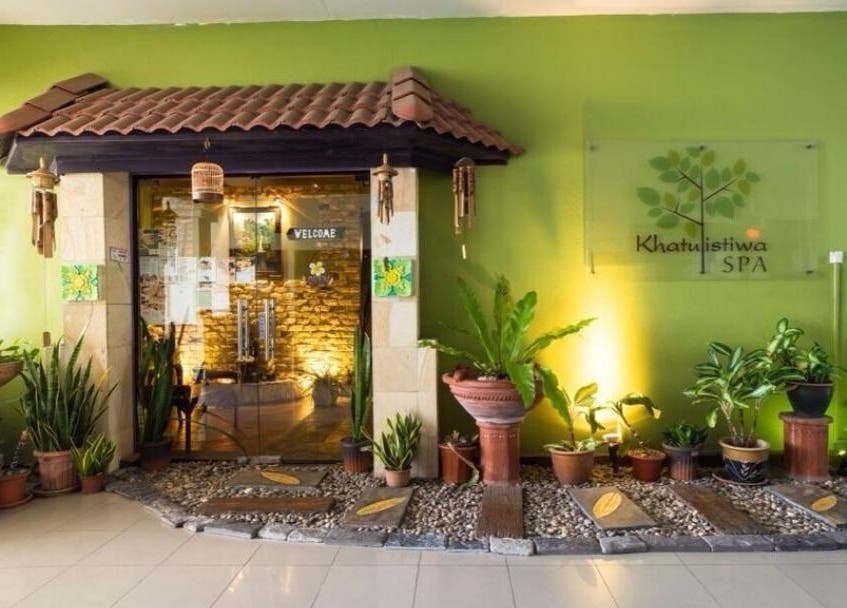 Entrance to Khatulistiwa Spa - Johor, showcasing a serene ambiance with tropical plants in Johor, Johor, MY.