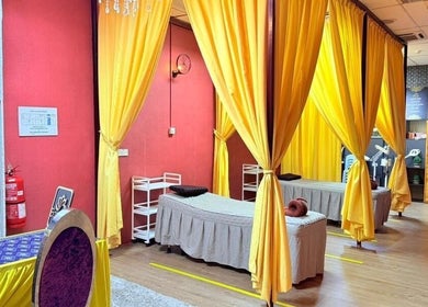 Relaxing treatment area at Kolej Komuniti Batu Gajah, Batu Gajah, Perak, MY with vibrant yellow curtains.