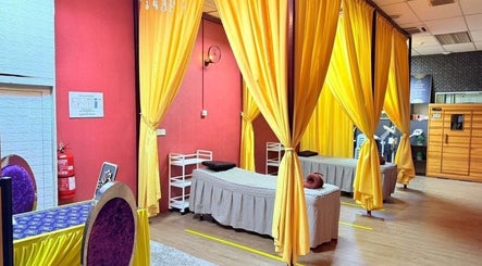 Relaxing treatment area at Kolej Komuniti Batu Gajah, Batu Gajah, Perak, MY with vibrant yellow curtains.