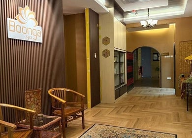 Elegant lounge at Kolej Komuniti Batu Gajah, Batu Gajah, Perak, MY with wooden decor and ambient lighting.