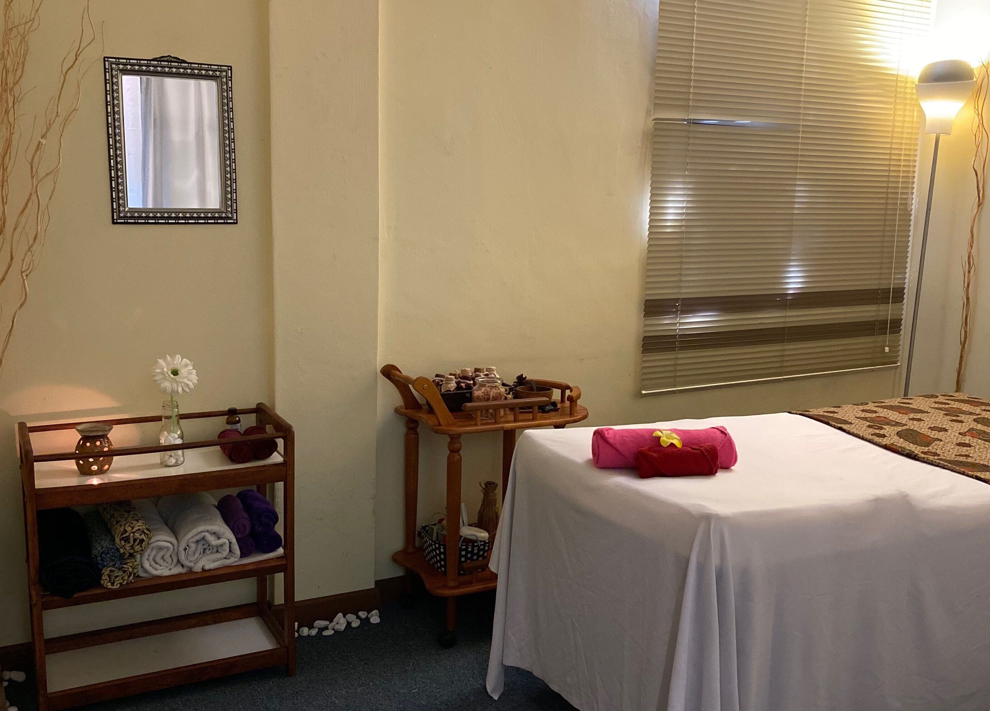 Relaxing treatment room in Libo Spa, Alor Setar, Kedah, MY with massage bed, soft lighting, and calming decor.