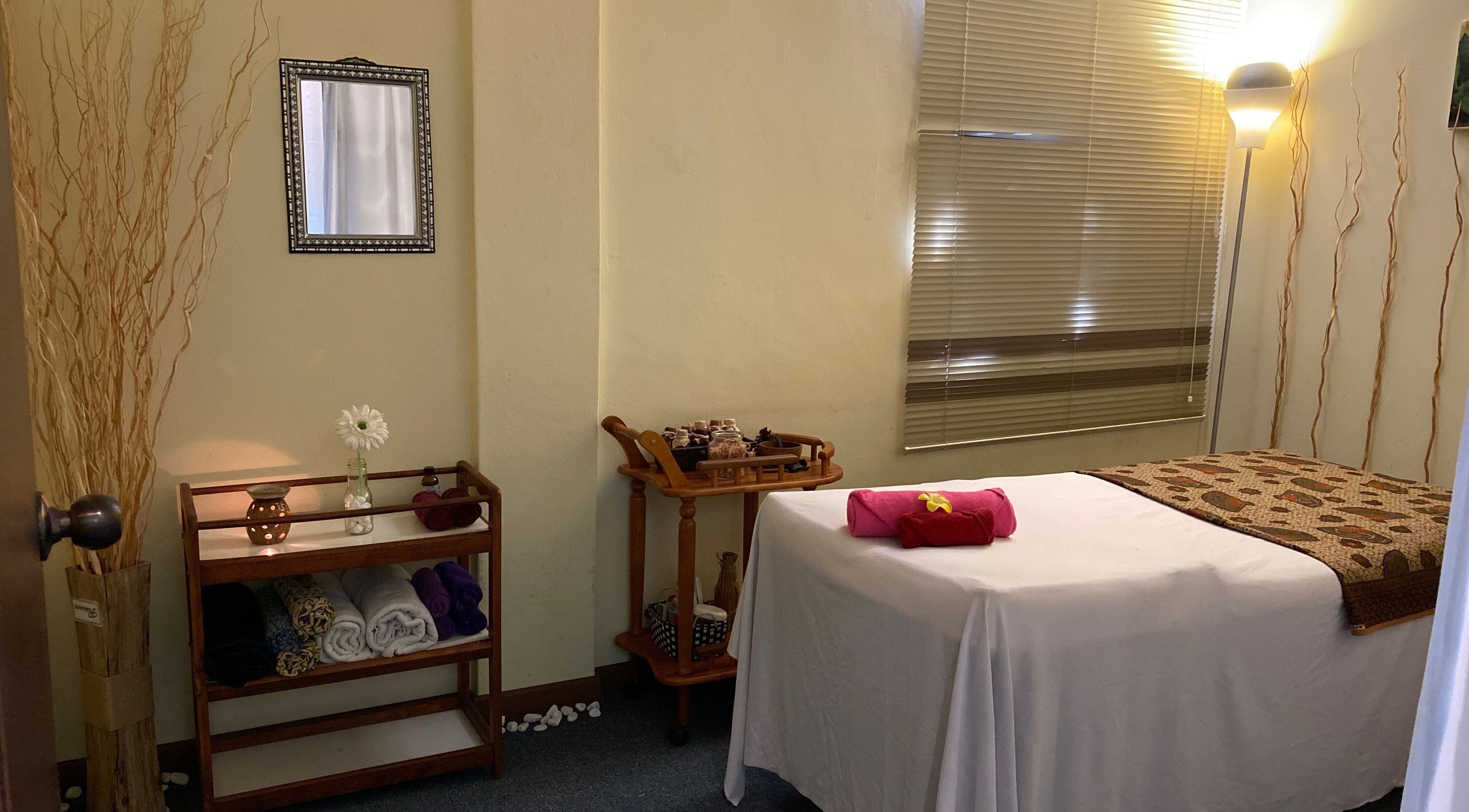 Relaxing treatment room in Libo Spa, Alor Setar, Kedah, MY with massage bed, soft lighting, and calming decor.