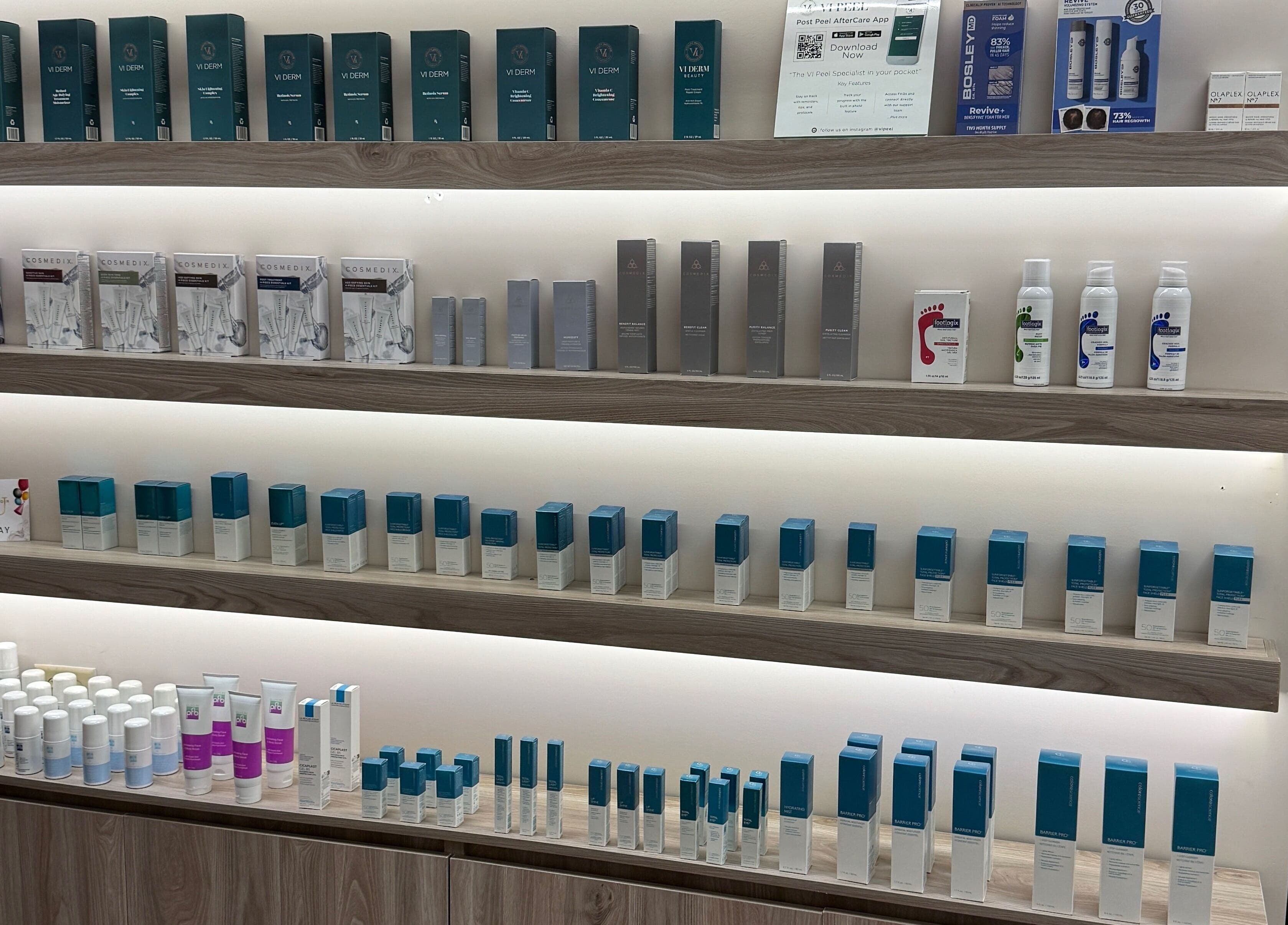 Product shelves at Enhance Aesthetics in Canaan, Tobago, TT showcasing skincare items.