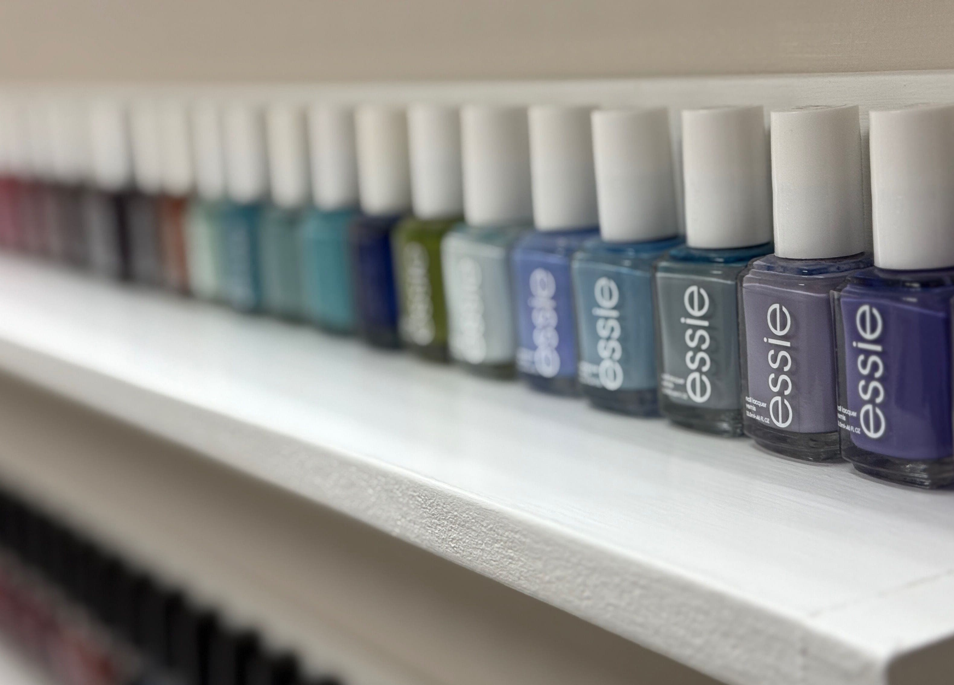 Vibrant nail polish selection at Enhance Aesthetics, Canaan, Tobago, TT, offers variety for every taste.