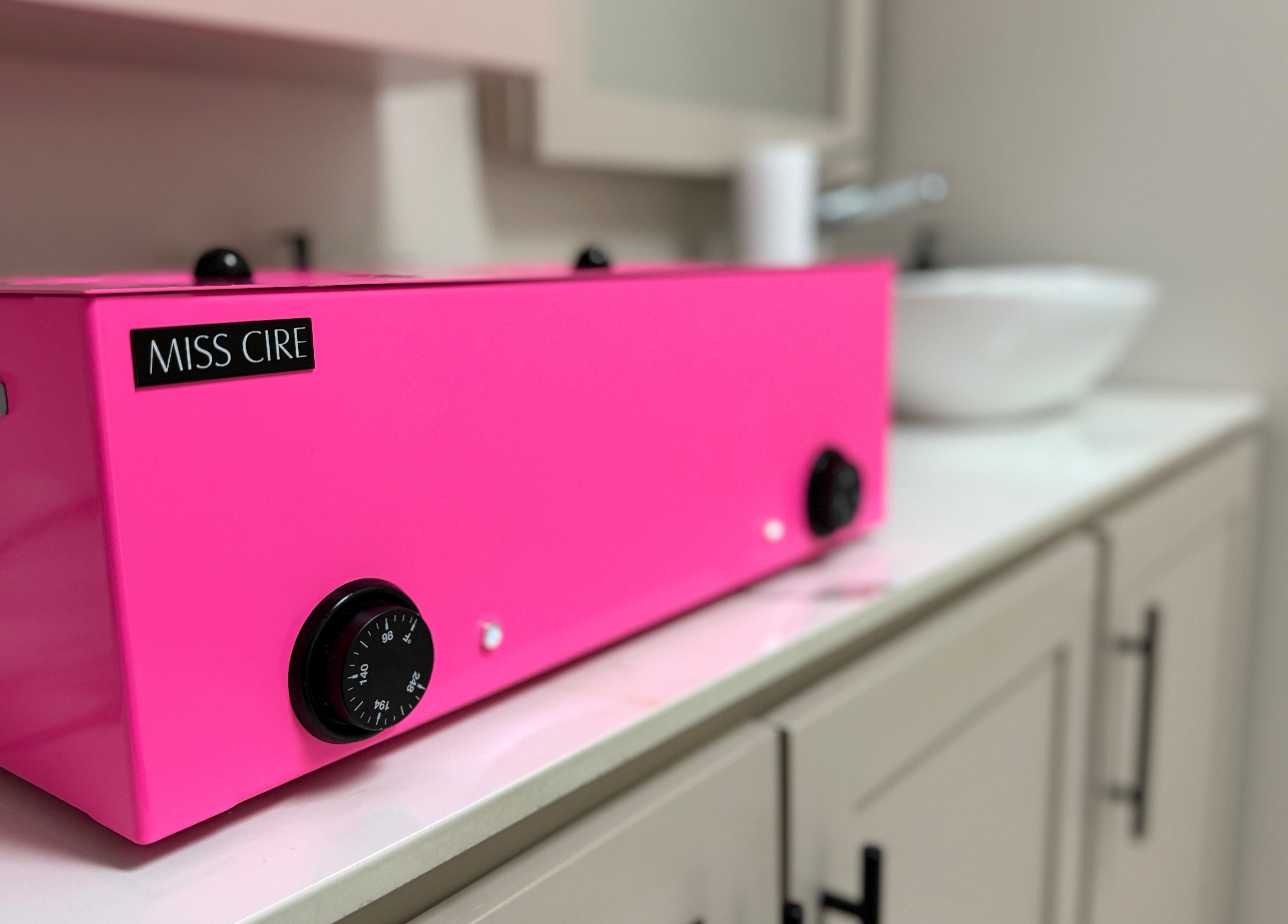 Miss Cire wax heater in Enhance Aesthetics, Canaan, Tobago, TT adds a pop of color to the sleek interior.