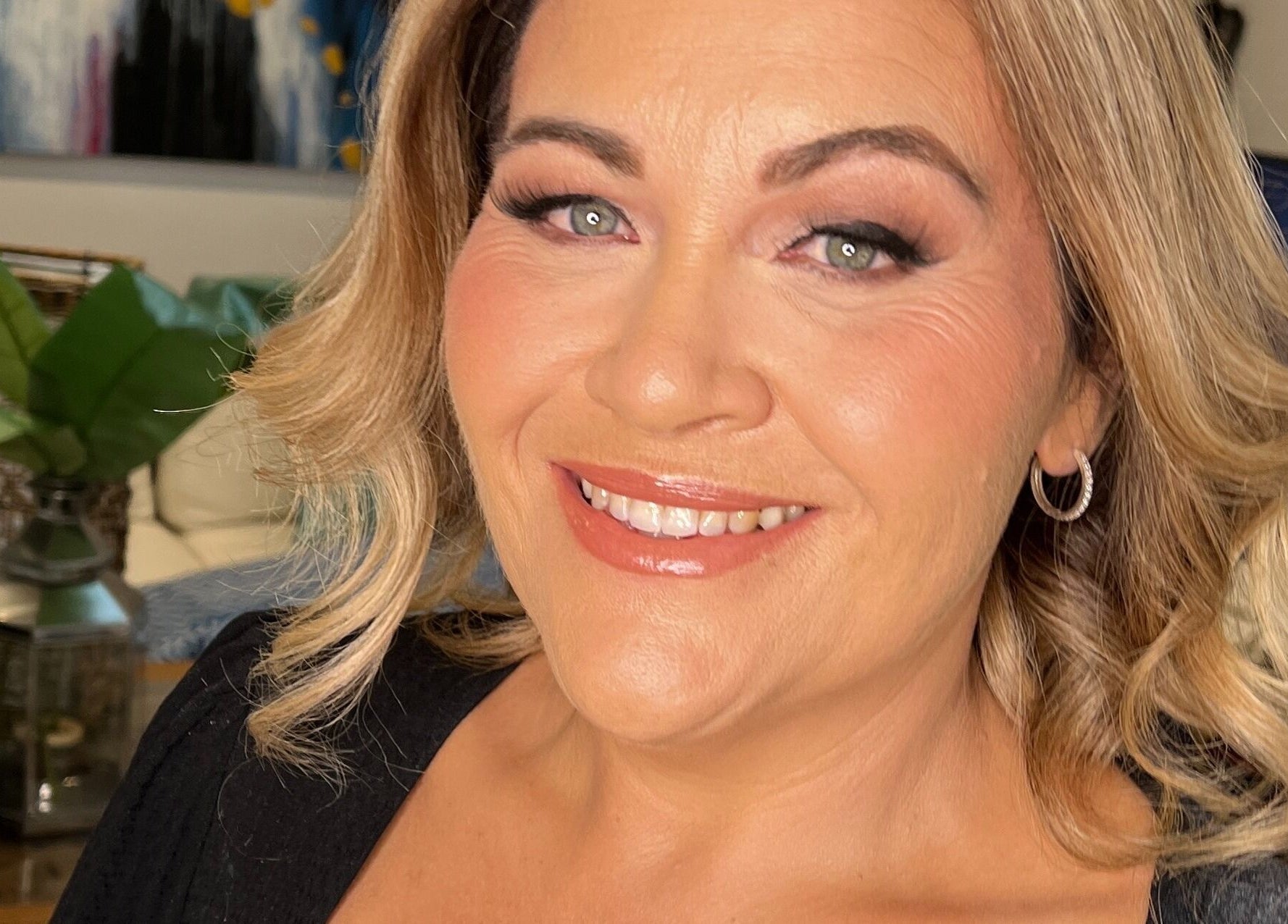 A smiling woman with elegant makeup at Shantelle Barry Hair & Makeup, Gordonvale, Queensland, AU.