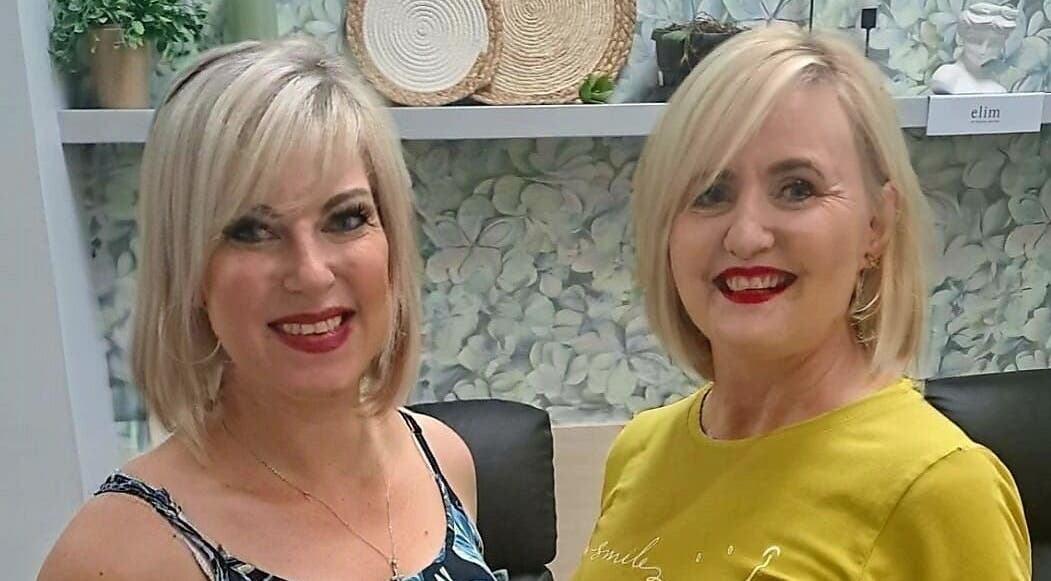 Two happy clients at Zoots Hair Salon, Mbombela, Mpumalanga, ZA, showcasing stylish blonde haircuts.