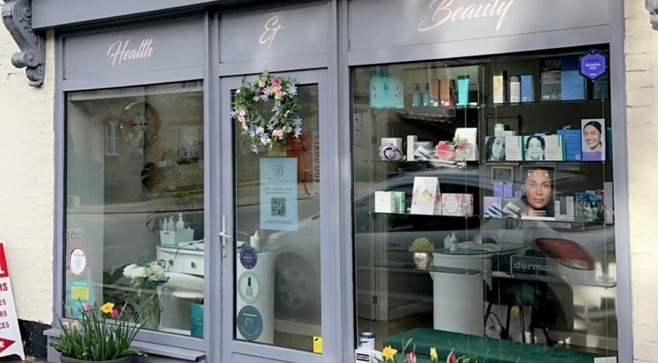 Charming storefront of Blossom Health and Beauty in Great Shelford, England, GB with vibrant decor.