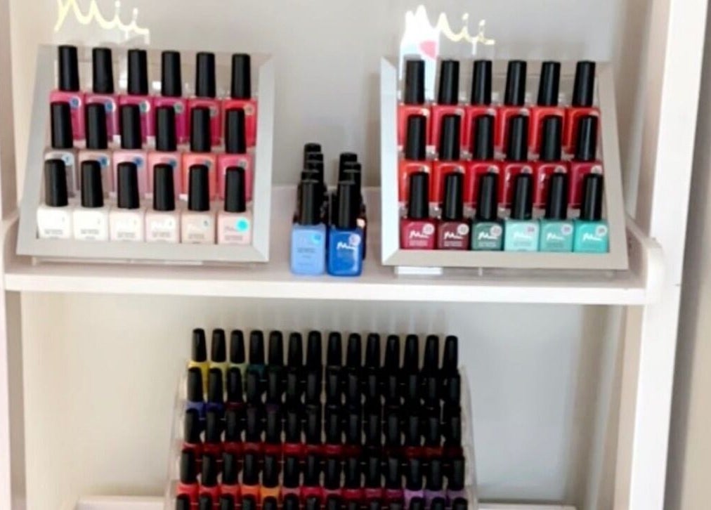 Nail polishes array at Blossom Health and Beauty, Great Shelford, England, GB.
