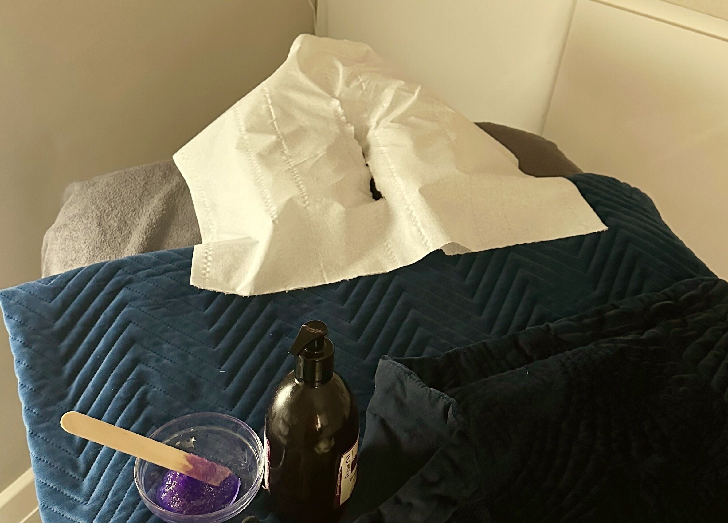 Relaxing treatment room at Blossom Health and Beauty in Great Shelford, England, GB with essential spa items.