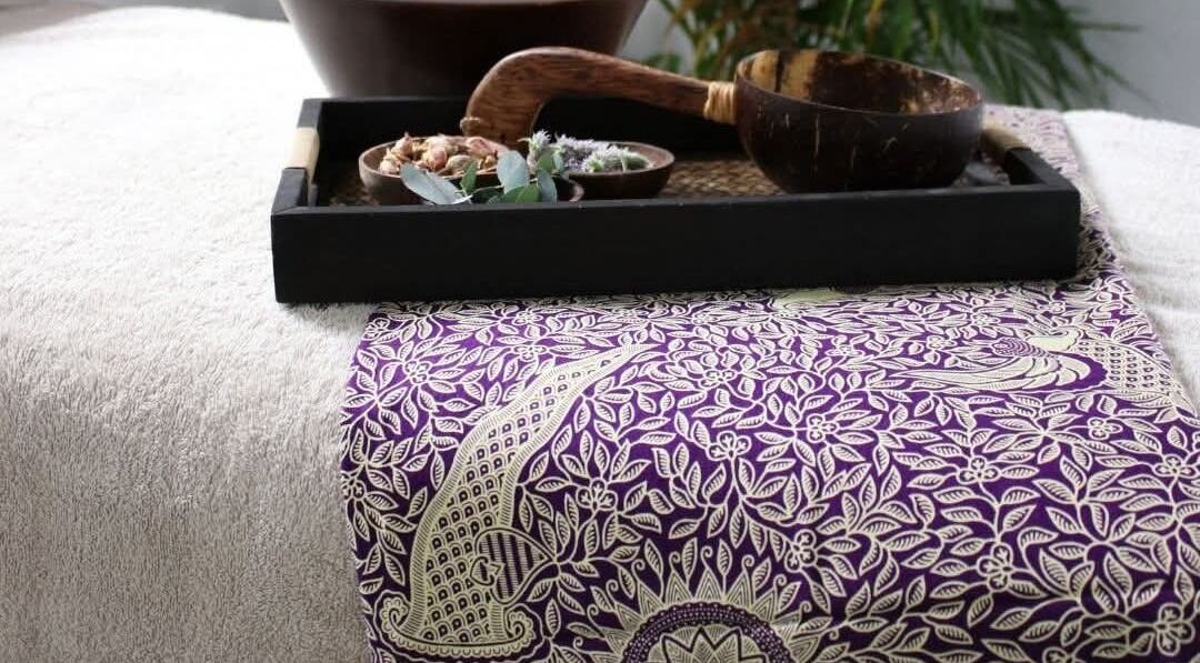 Relaxing spa setup with purple patterned throw at Stacey's Studio: Skincare & Wellness, Doddington, England, GB.