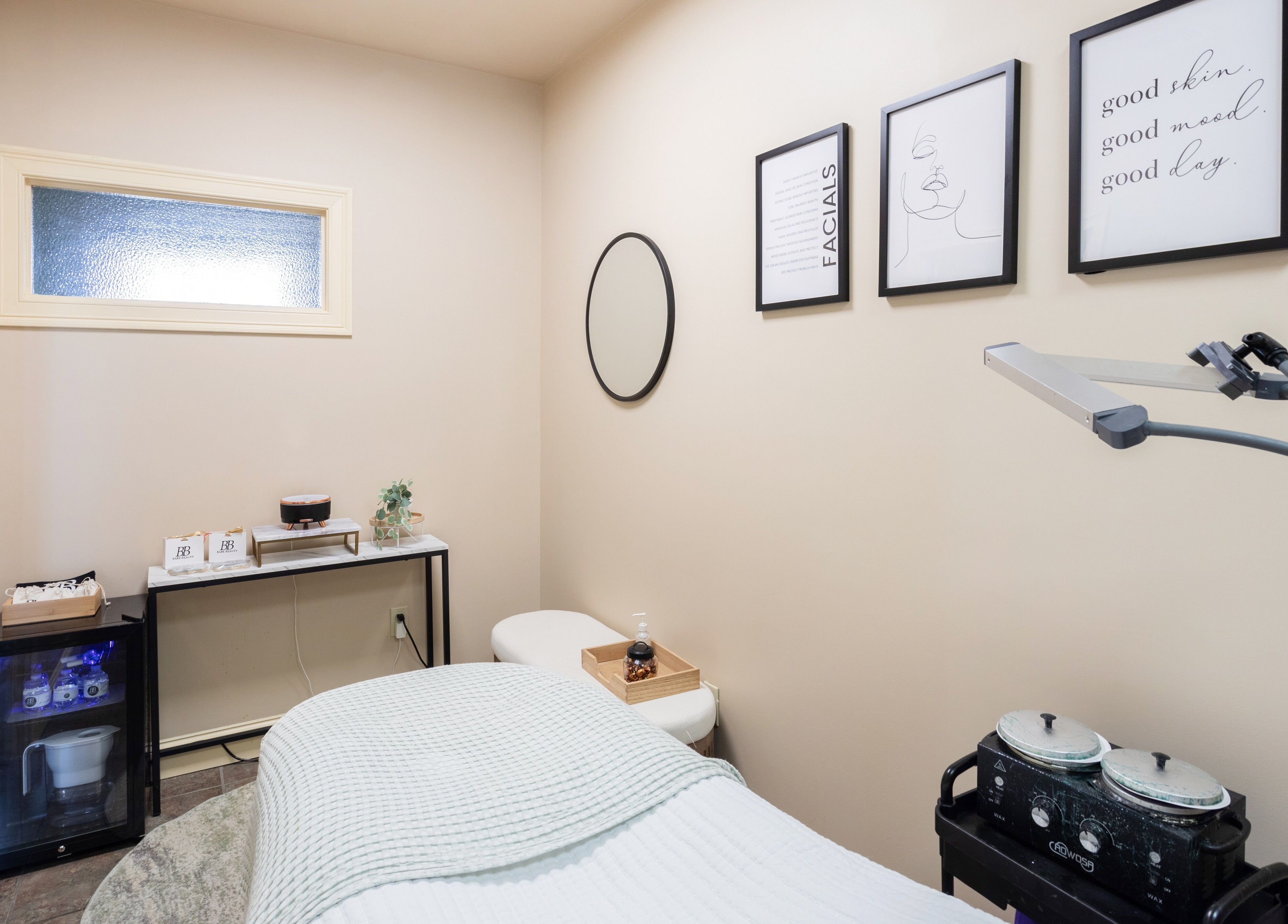 Treatment room at Bare Beauty Aesthetics in Ludlow, Massachusetts, US, featuring calming decor and modern equipment.