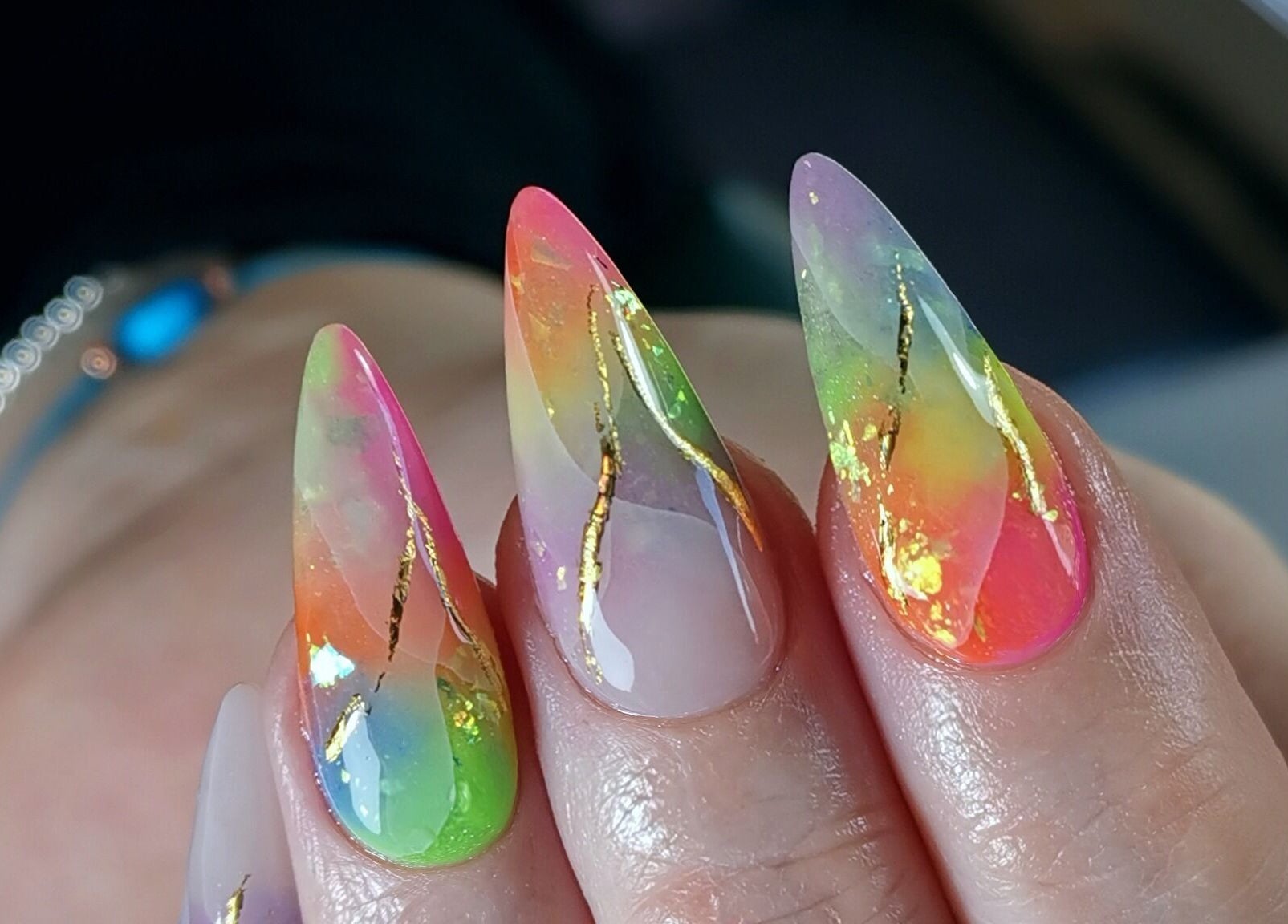 Colorful nail design by Kerry Wright Nail Artist in Rotherham, England, GB features gold accents.
