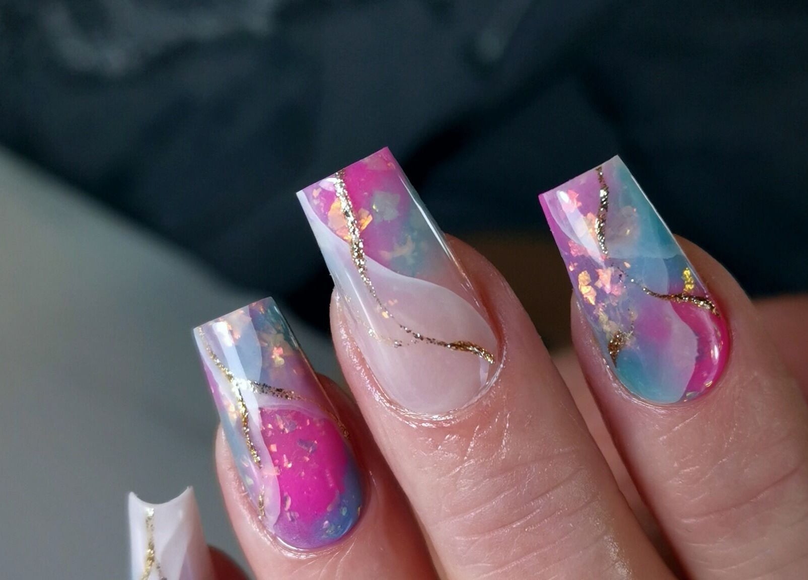 Elegant abstract nail art by Kerry Wright Nail Artist in Rotherham, England, GB with pink and gold accents.