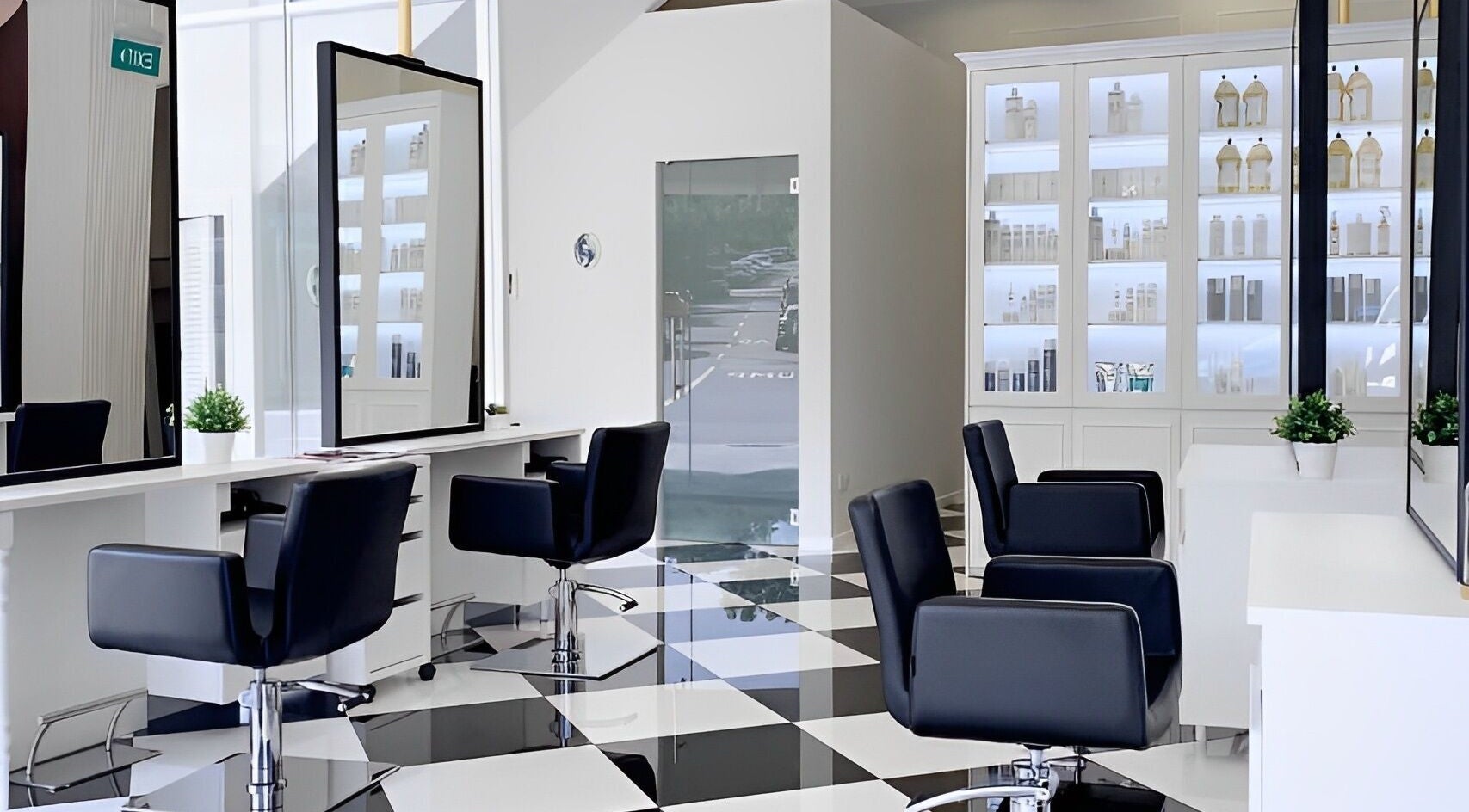 Modern interior of Salon de Edmund in Singapore, Bishan, SG showcasing chic styling chairs and elegant decor.