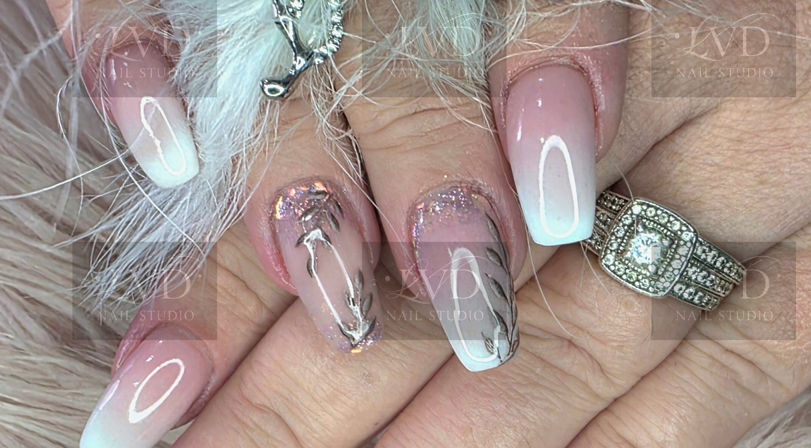 Intricate nail art design with floral accents at LVD NAIL STUDIO, Pretoria, Gauteng, ZA.