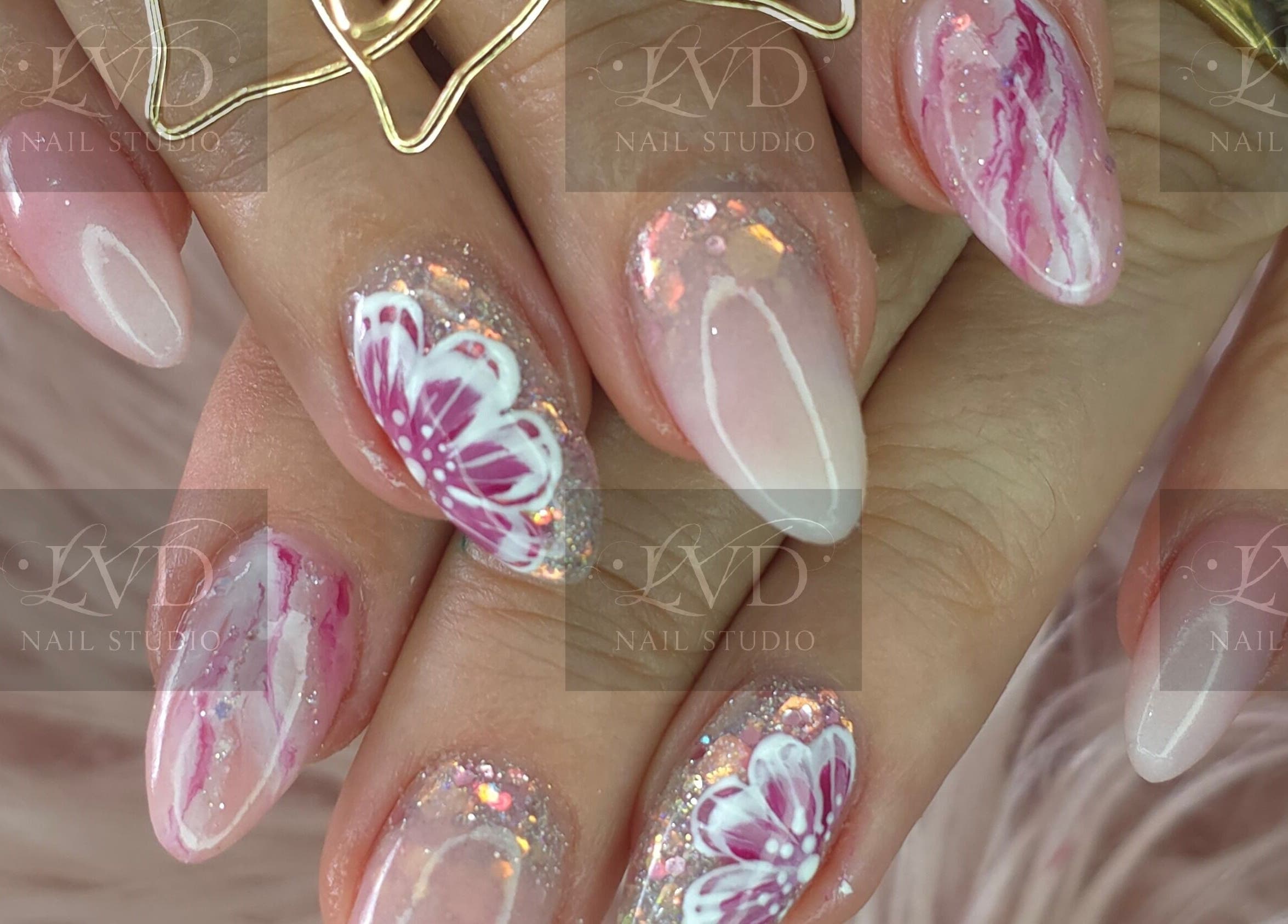 Intricate nail art with floral designs at LVD NAIL STUDIO, Pretoria, Gauteng, ZA.