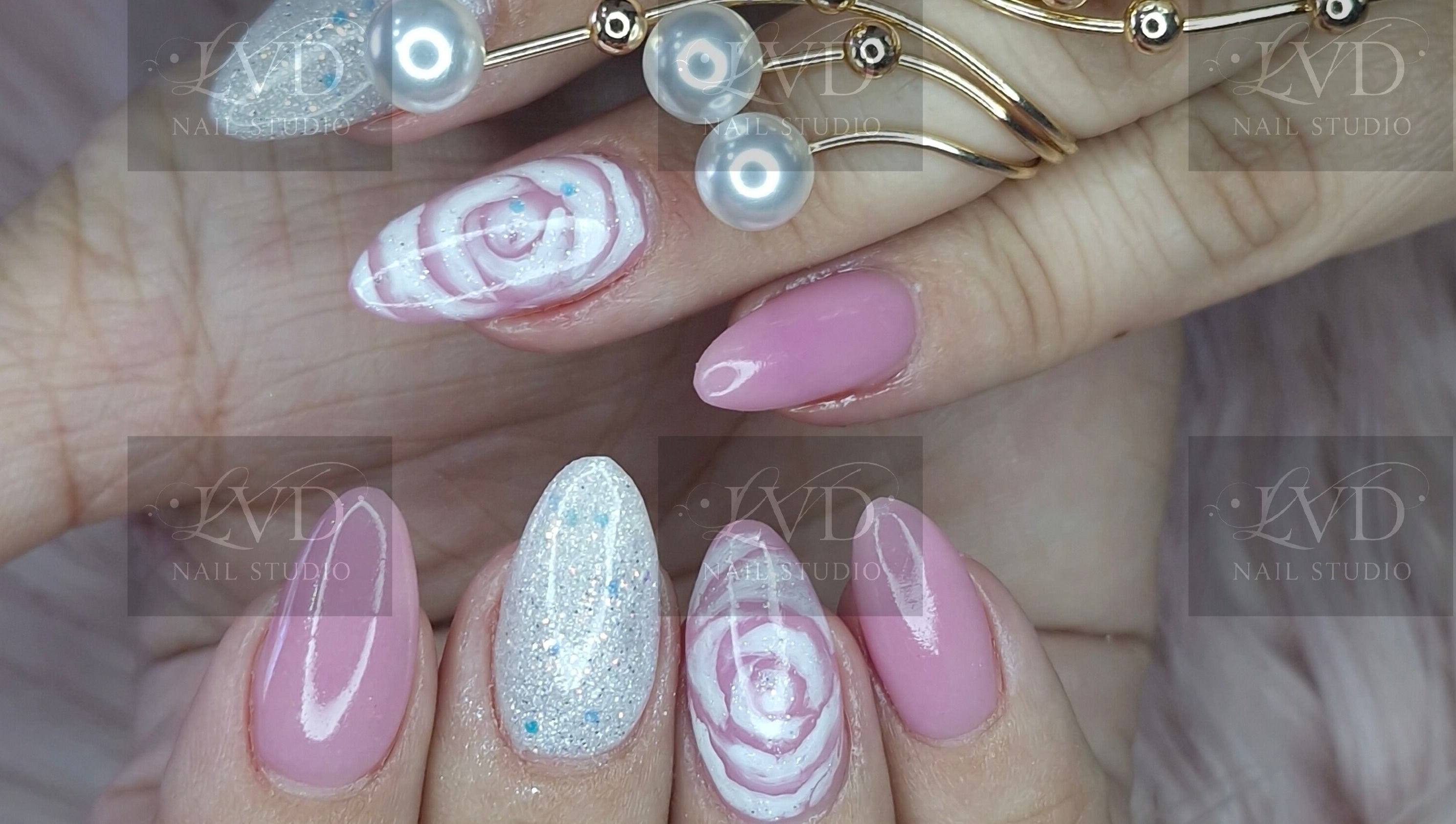Chic floral and glitter nail art at LVD NAIL STUDIO, Pretoria, Gauteng, ZA. Perfect for a stylish look.