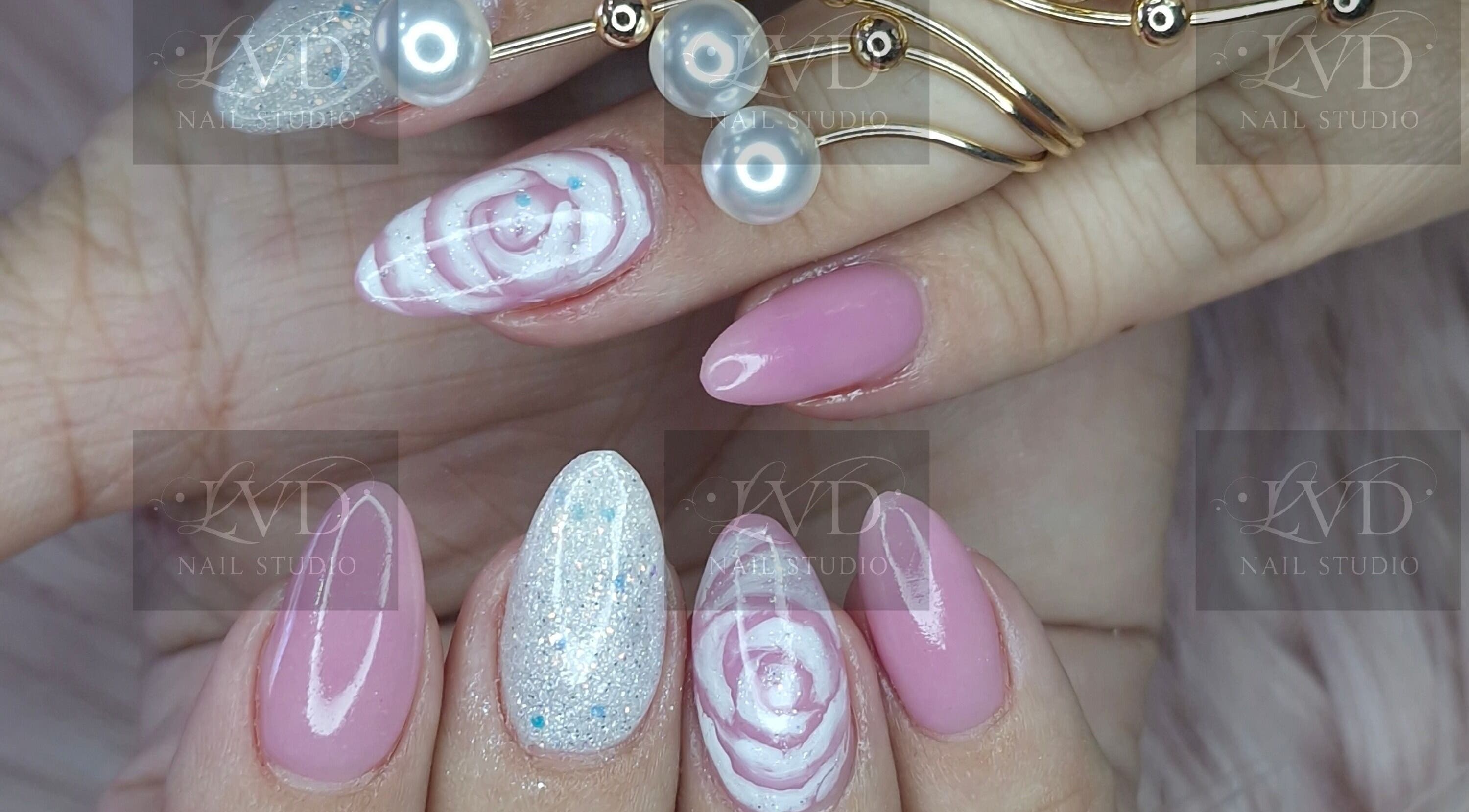 Chic floral and glitter nail art at LVD NAIL STUDIO, Pretoria, Gauteng, ZA. Perfect for a stylish look.