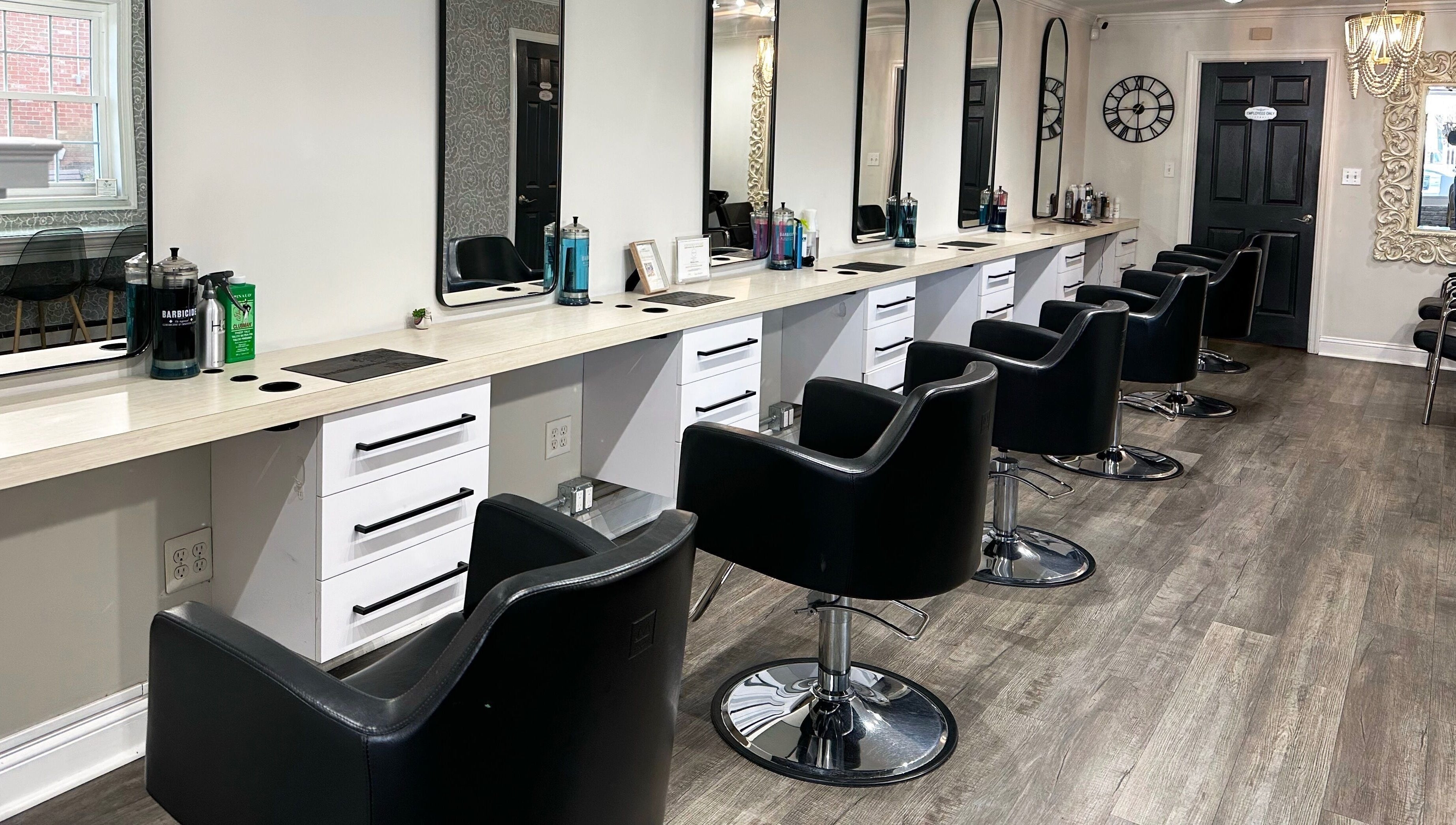 Modern styling chairs at Bounce Hair Salon in Port Jefferson, New York, US, offering luxury hair services.