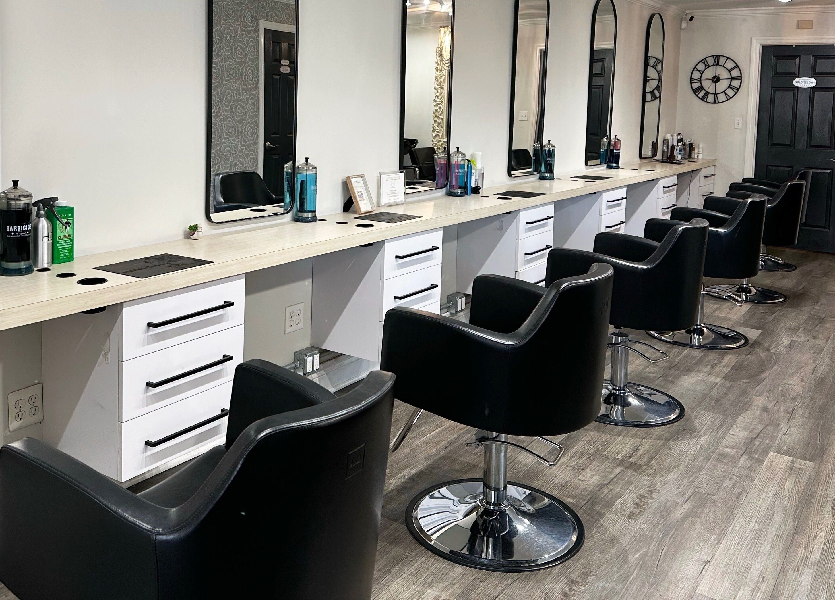 Modern styling chairs at Bounce Hair Salon in Port Jefferson, New York, US, offering luxury hair services.
