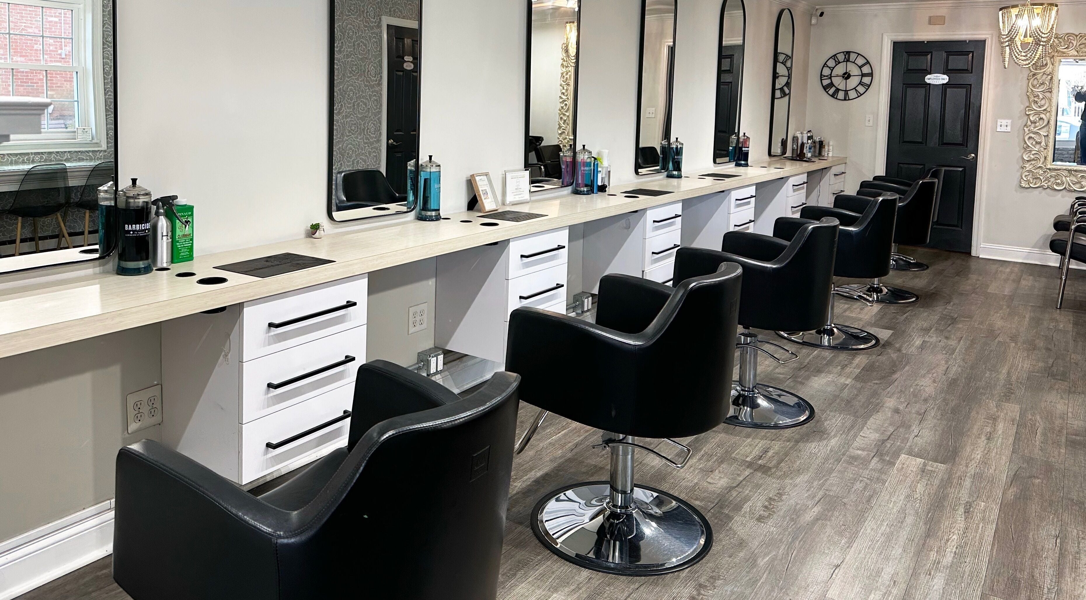 Modern styling chairs at Bounce Hair Salon in Port Jefferson, New York, US, offering luxury hair services.