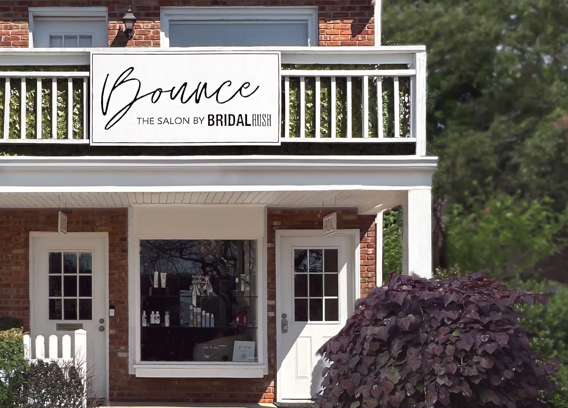 Exterior of Bounce Hair Salon located in Port Jefferson, New York, US, showcasing its welcoming entrance.