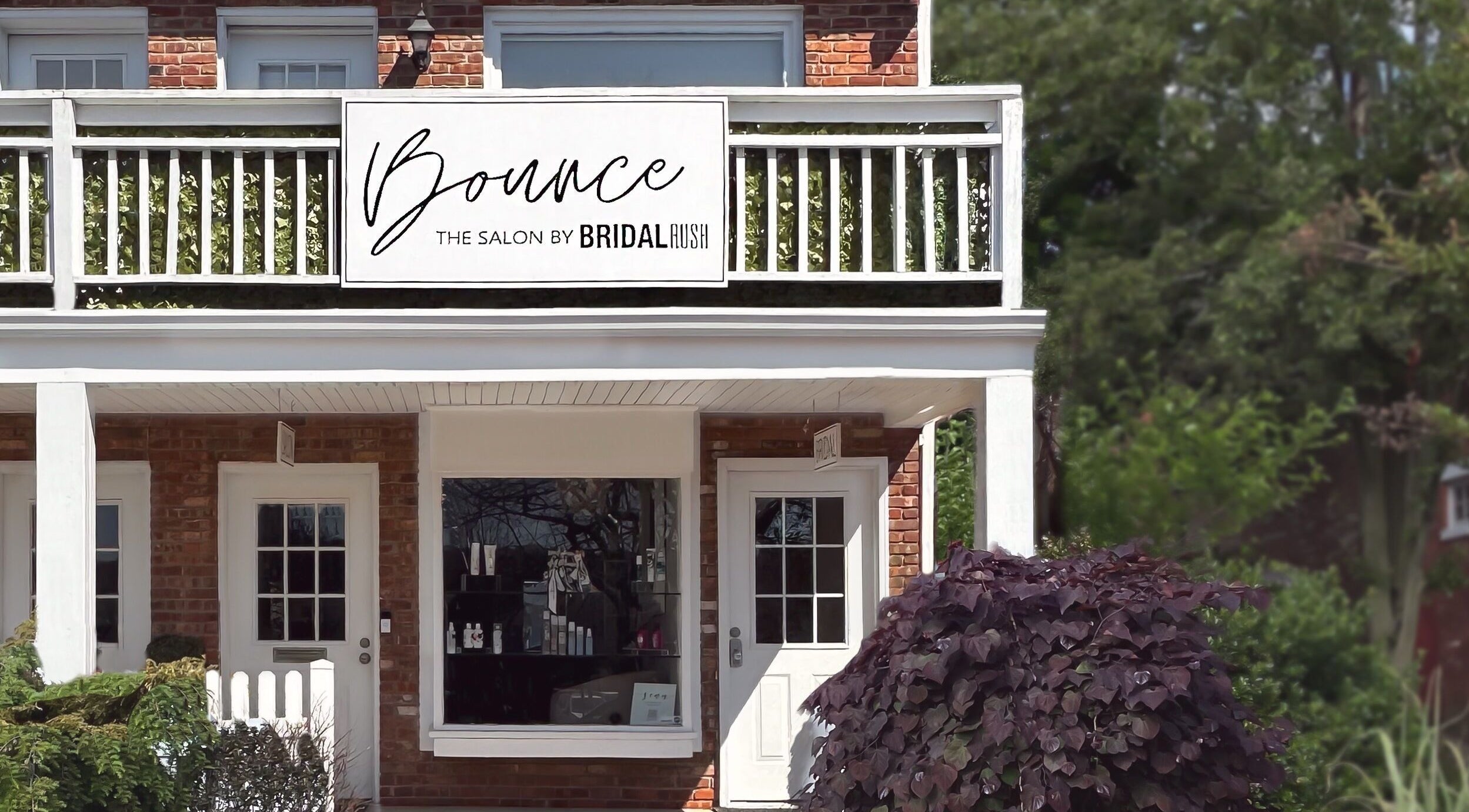 Exterior of Bounce Hair Salon located in Port Jefferson, New York, US, showcasing its welcoming entrance.