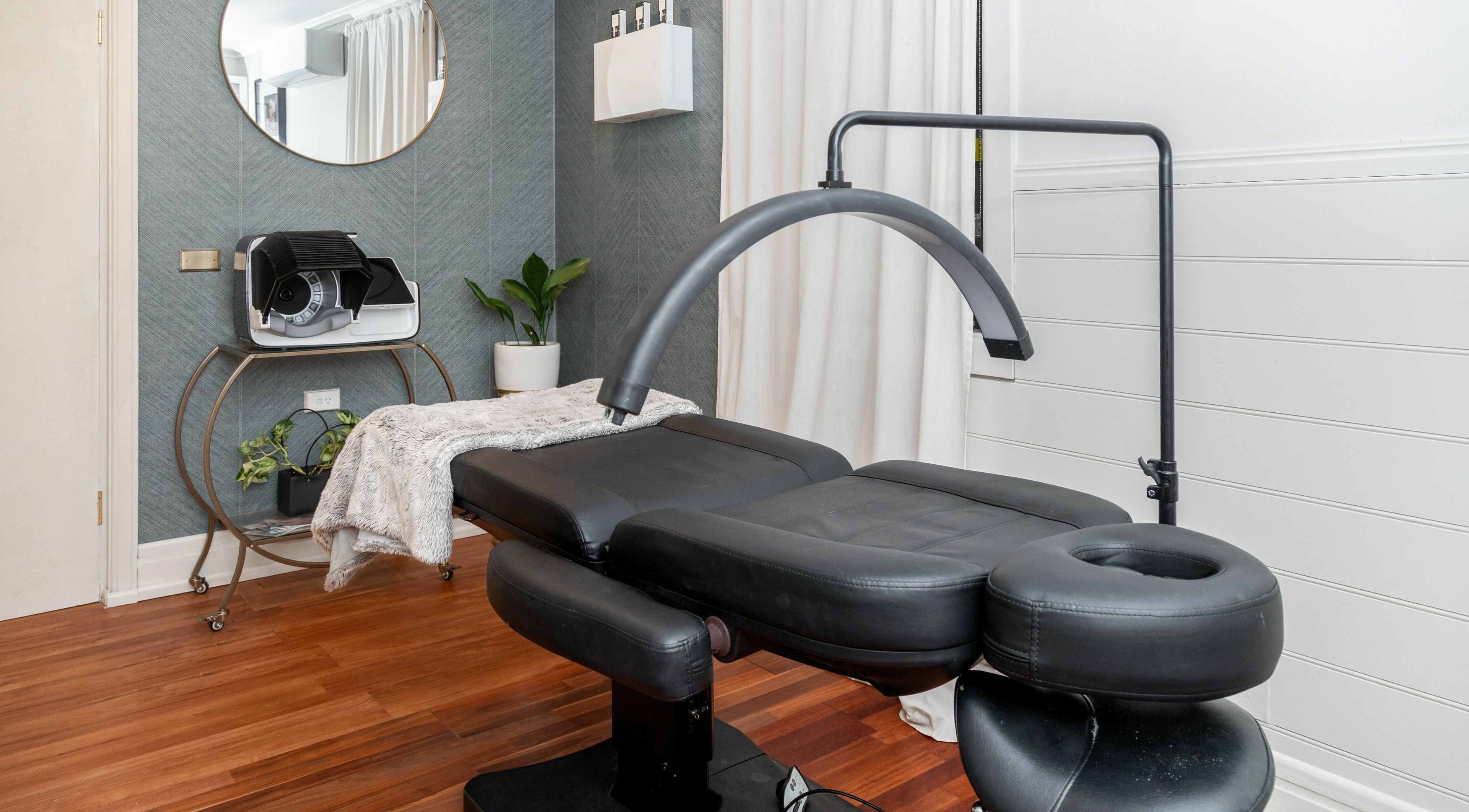 Relaxing spa room at Bespoke Beauty Collective in North Sydney, New South Wales, AU, featuring plush treatment bed.