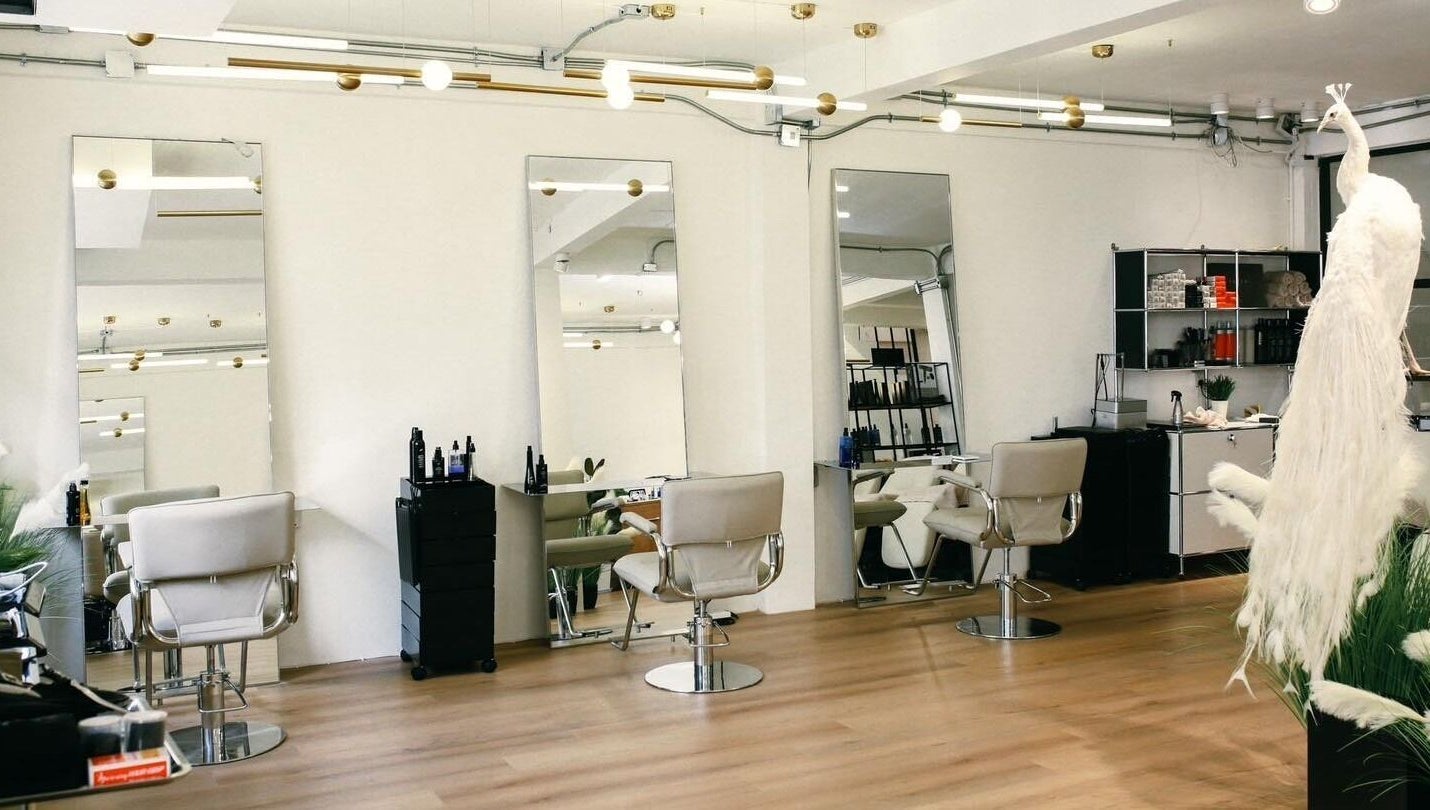 Interior of Lil Holistic Salon in Krung Thep Maha Nakhon, featuring modern chairs and mirrors.