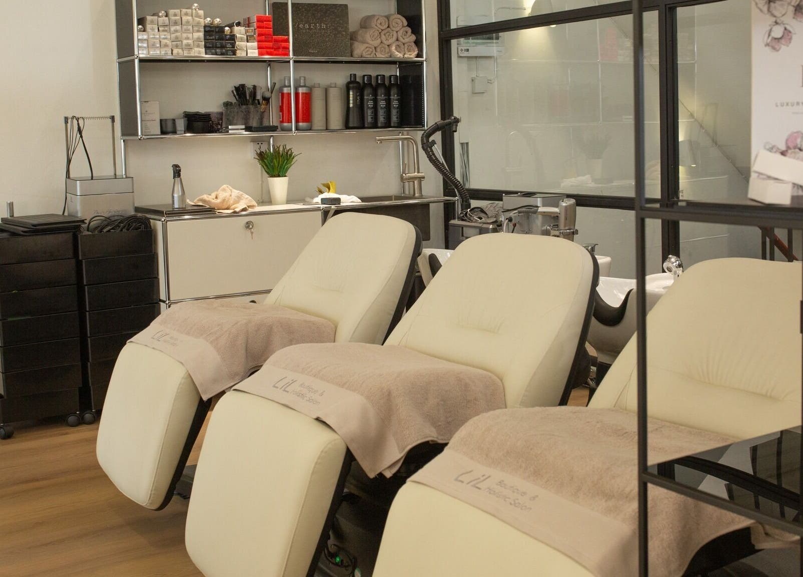 Cozy salon chairs at Lil Holistic Salon, Krung Thep Maha Nakhon, offering a relaxing beauty experience.